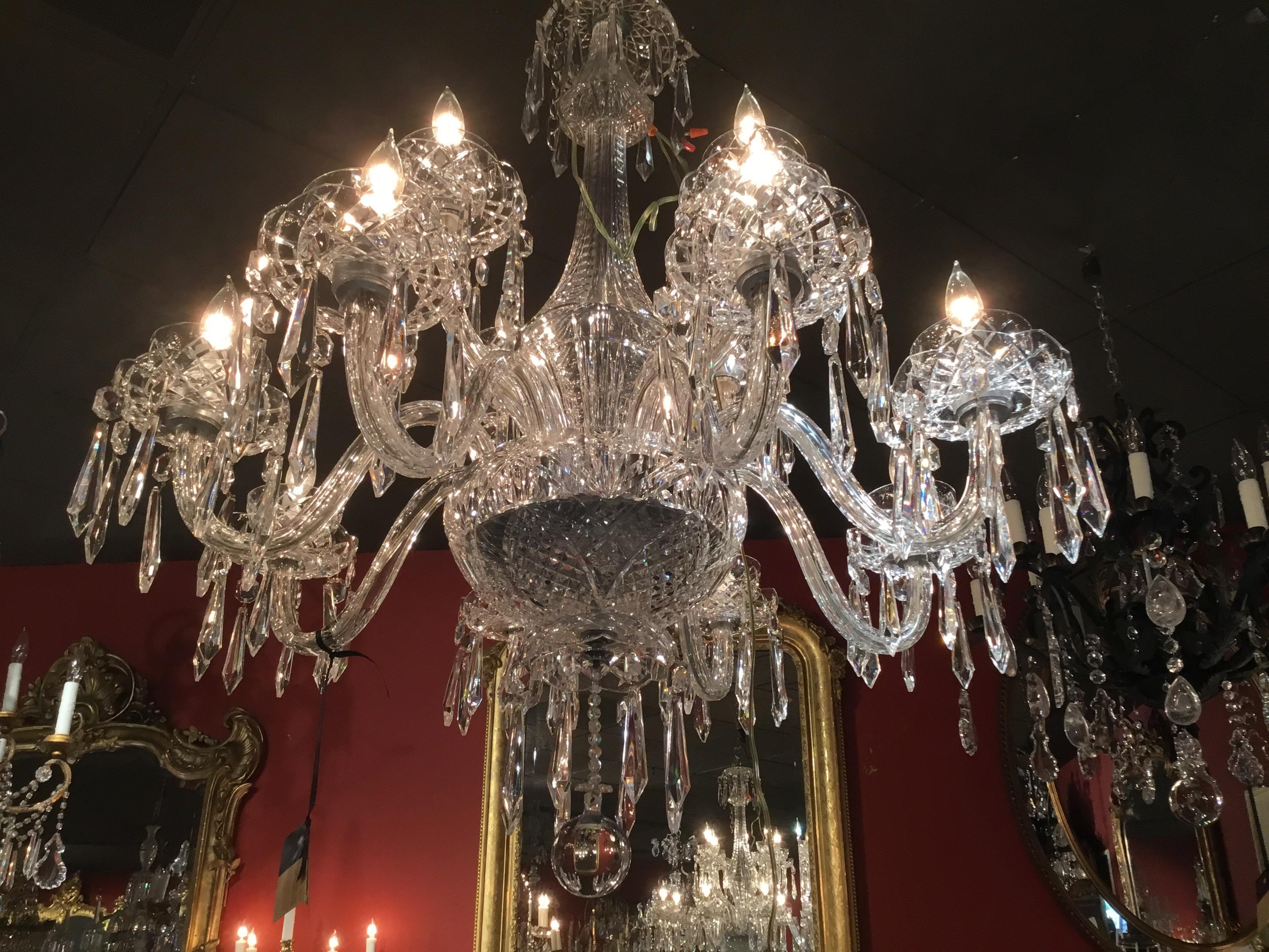 Elegant clear crystal chandelier with 12-light ensconced in 2 bobeches.
A central stem in crystal adds elegant height and beauty.
