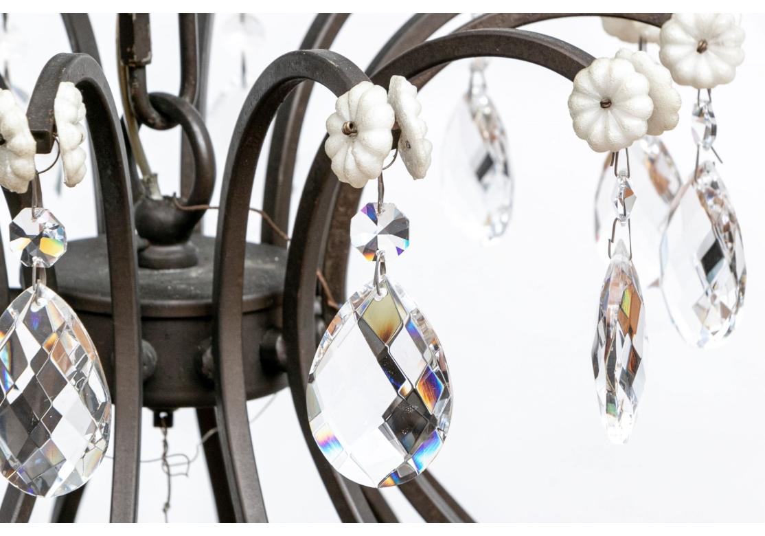 Hollywood Regency 12 Light Wrought Iron And Crystal Chandelier For Sale