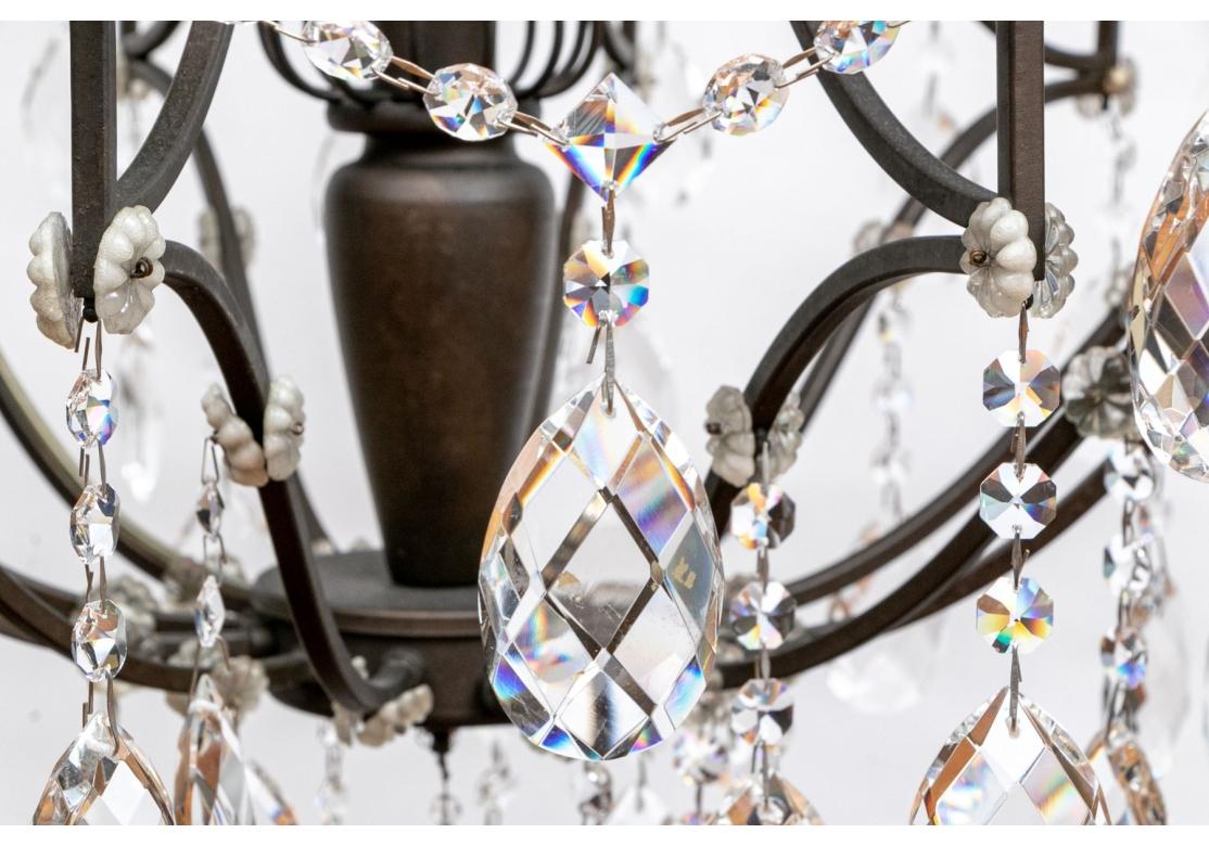 20th Century 12 Light Wrought Iron And Crystal Chandelier For Sale