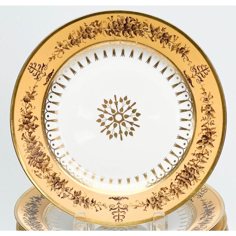 12 Manufacture de Sevres gilt porcelain dessert plates Nankin Yellow 1815-1824

12 Manufacture de Sevres porcelain dessert plates, 1815-1824. A white ground to center, a nankin yellow ground to the edge with brown painted roses. Gilt