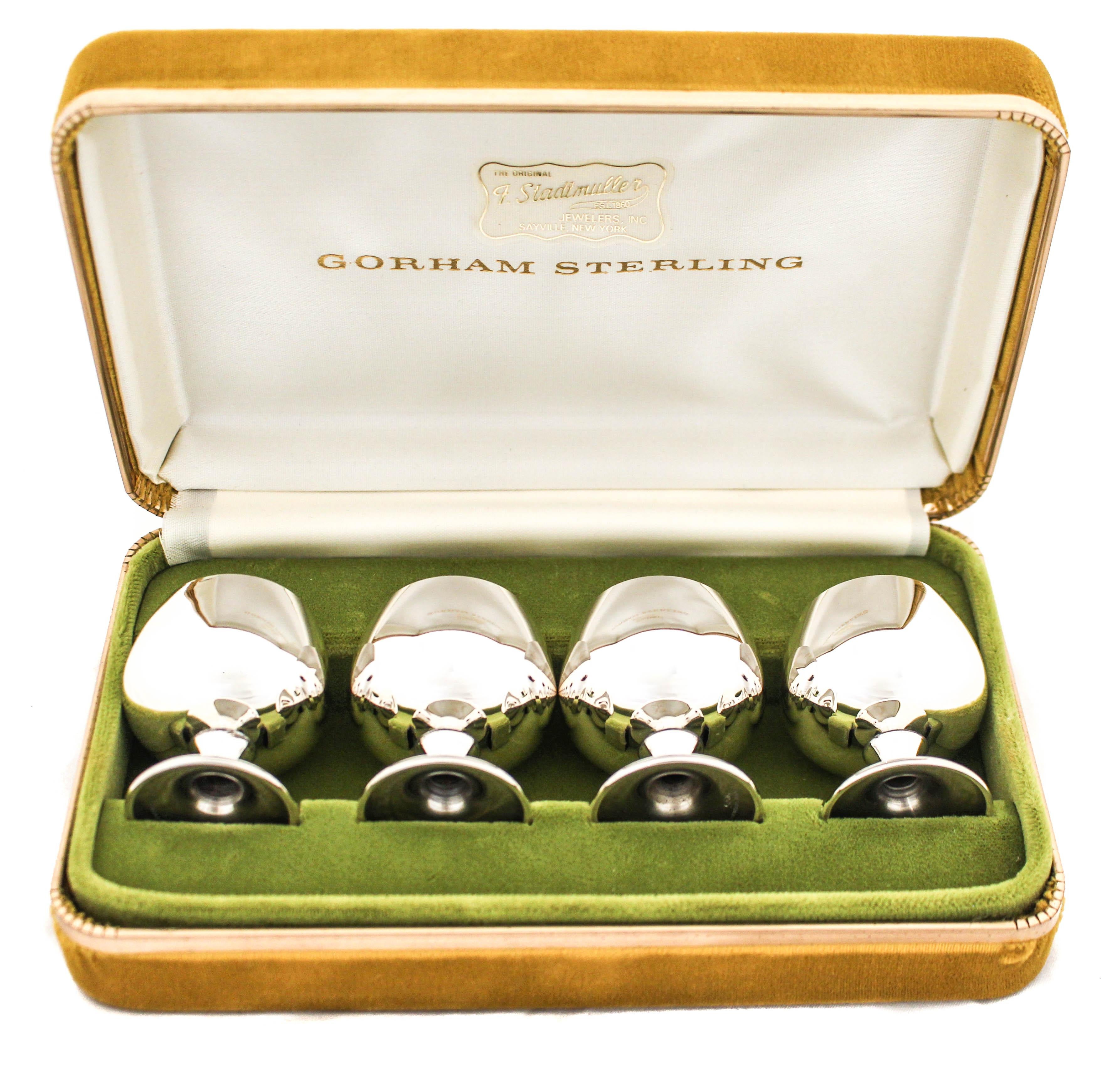 We are thrilled to present this set of twelve Mid-Century Modern sterling silver cordials in their original boxes. There are four cordials per box and three boxes, a total of twelve cordials. The boxes are in excellent condition and each cup fits