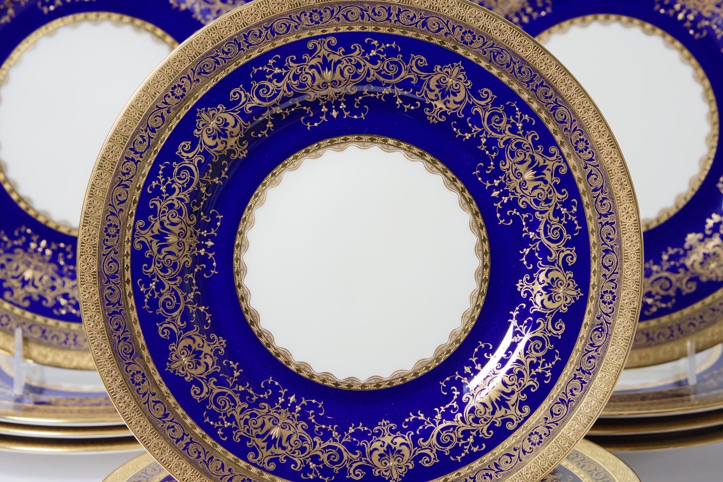An impressive set of 12 dinner or presentation plates by one of the Gilded Age's re known factories: Minton England. This set was custom ordered through the storied New York retailer of Rich & Fisher Fifth Ave at the turn of the last century.