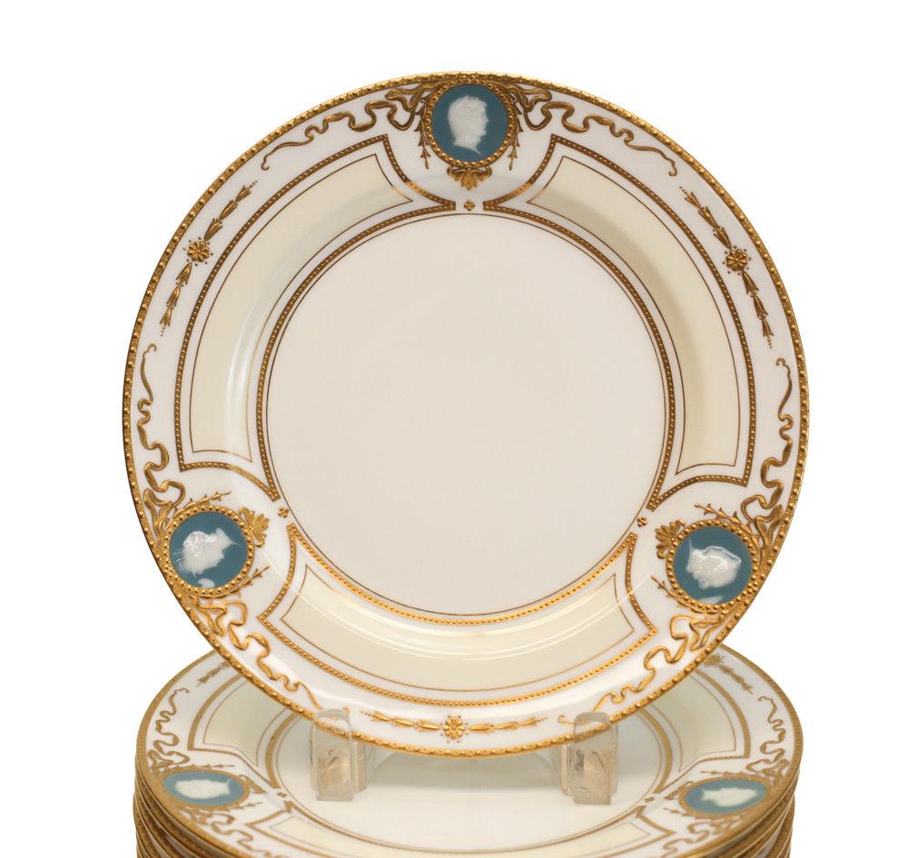 12 exquisite Minton for Tiffany & Co. Pate-Sur-Pate porcelain blue and ivory color ground dessert plates, dated 1920. Stunning gilt bead-work stripes to the plates with three cameo portrait medallions to the borders. Signed 