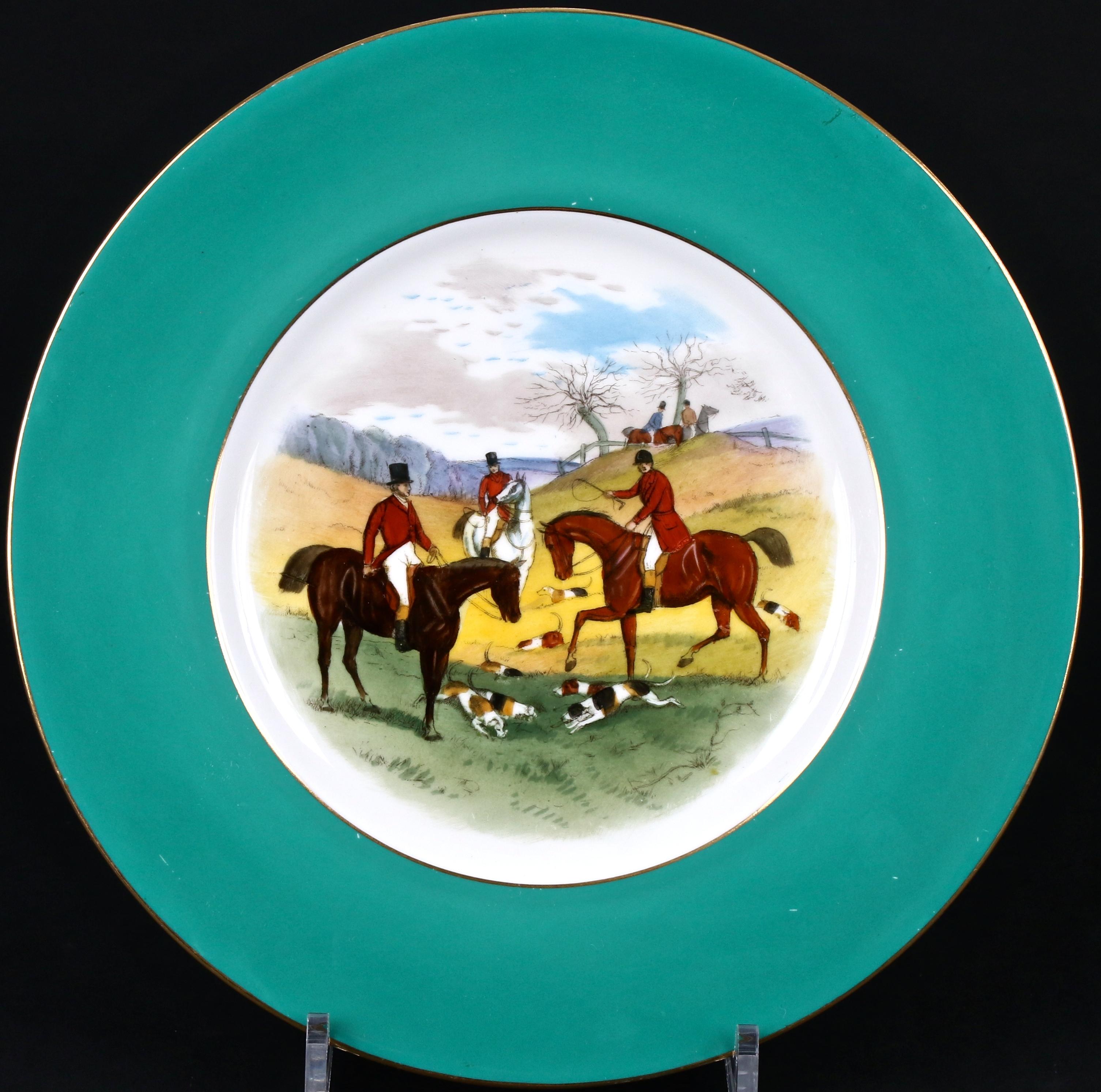 These 12 fox hunt cabinet or dinner plates are from Minton, Stoke-on-Trent, England. Each green-bordered plate depicts a unique English fox hunting scene. Painted by famous Minton artist James Edwin Dean (1880-1935), who specialized in fish, game,