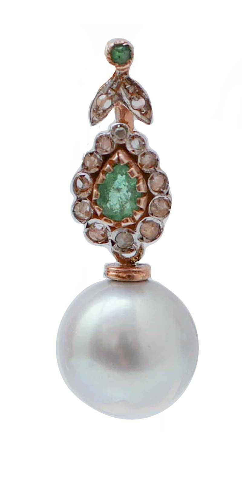 Fantastic earrings in 9 kt rose gold and silver structure mounted with emeralds and diamonds in the upper part. As pendant, a grey pearl.
Diamonds 0.27 ct
Emeralds 0.98  ct
Grey Pearls 5.10 gr
Total Weight 8.70 gr
RF *GAGH

For any informations,