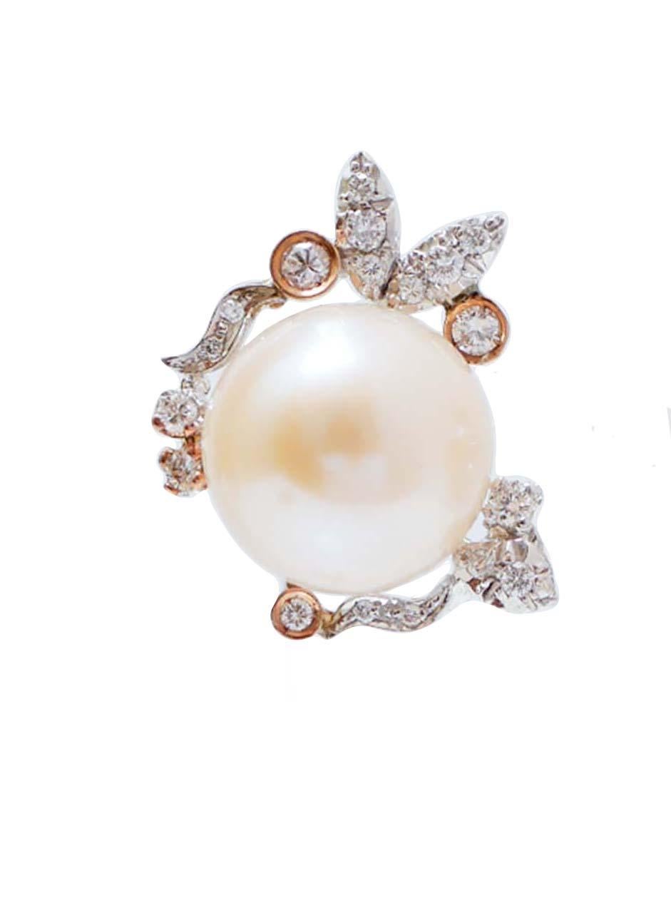 Elegant earrings in 14 kt white gold and rose gold structure mounted with a central pearl surrounded by diamonds.
These earrings were totally handmade by Italian master goldsmiths and they are in perfect conditions.
Diamonds 0.62 ct
Pearls 4.70