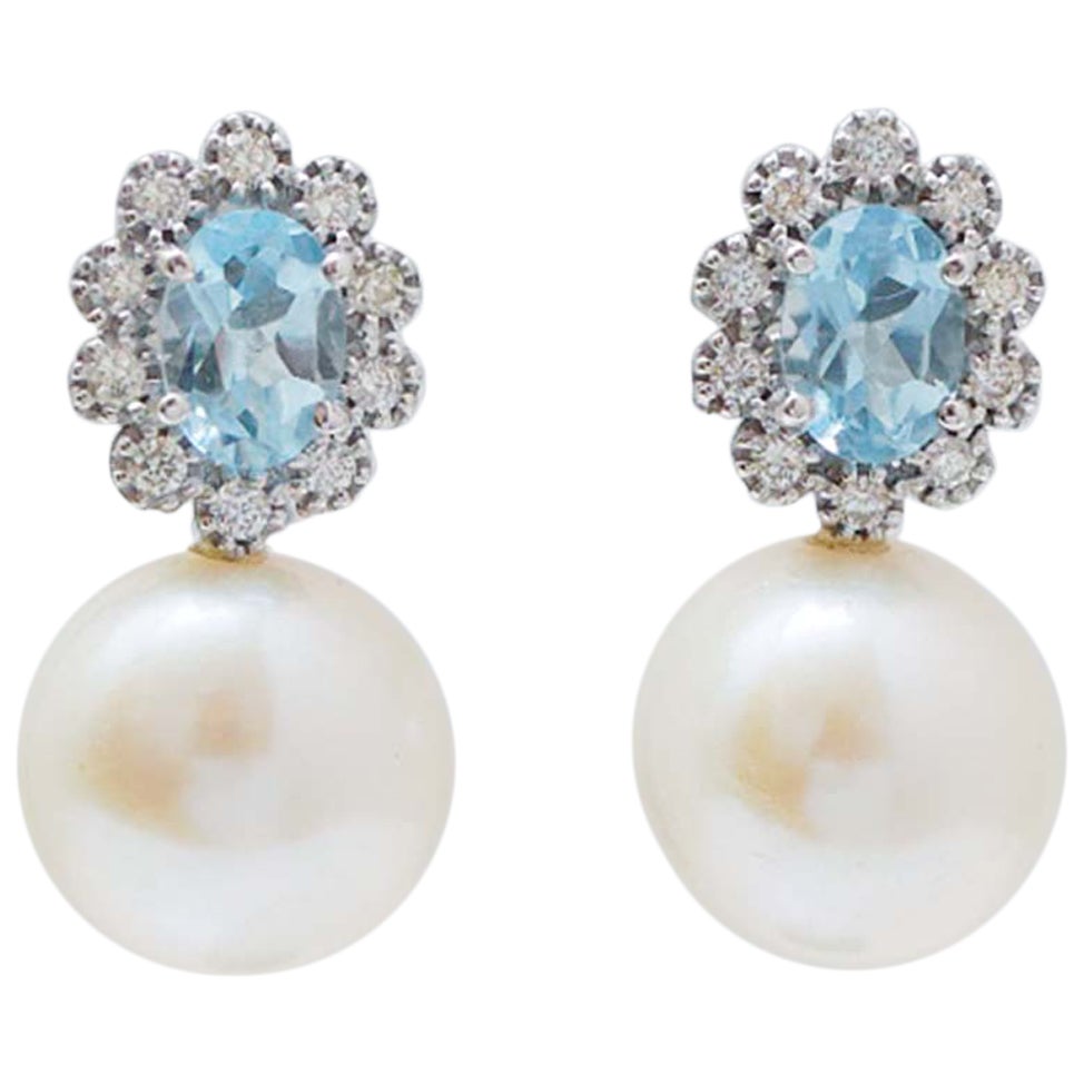 12 Mm Pearls, Topaz, Diamonds, 14 Karat White Gold Earrings.