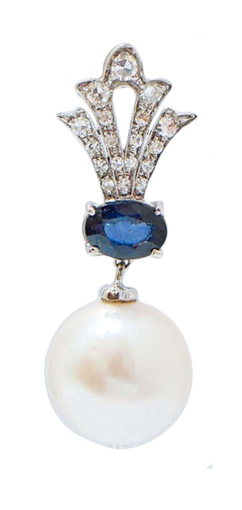 Fantastische Ohrringe aus 14-karätigem Weißgold, im oberen Teil mit Diamanten besetzt, in der Mitte ein Saphir und als Anhänger eine Perle.
Diamanten 0,53 ct
Saphire 1,94 ct
Perlen 5.00 gr - 12 mm
Gesamtgewicht 7.90 gr
RF +UOGE
RK.AFEA92

Für