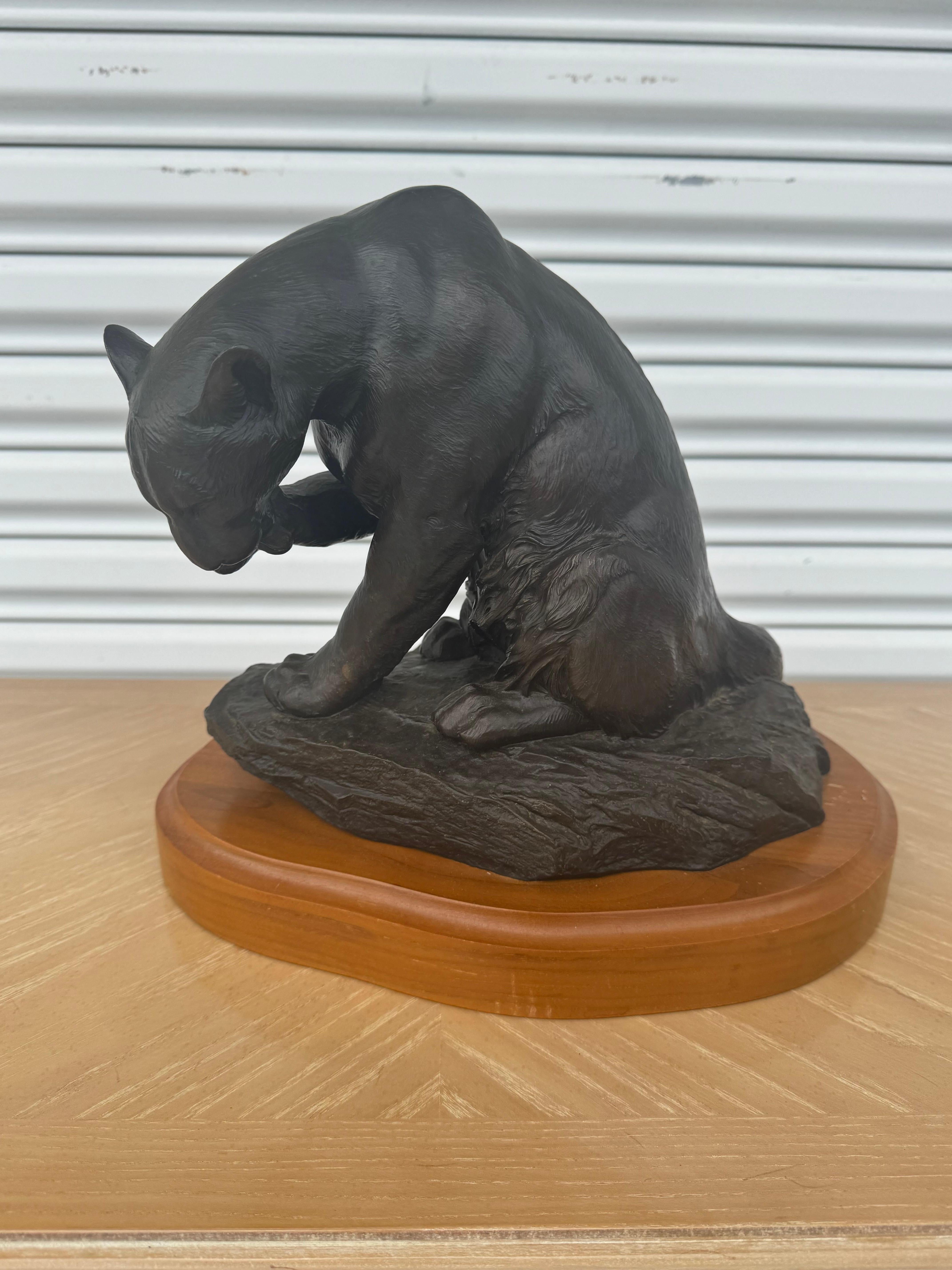 Nicholas Wilson was born in 1947. He now works out of Tubac, Arizona.
This sculpture depicts a Mountain Lion licking its paws.
The bronze is mounted on a solid wood base.
It's signed and numbered on the back.
