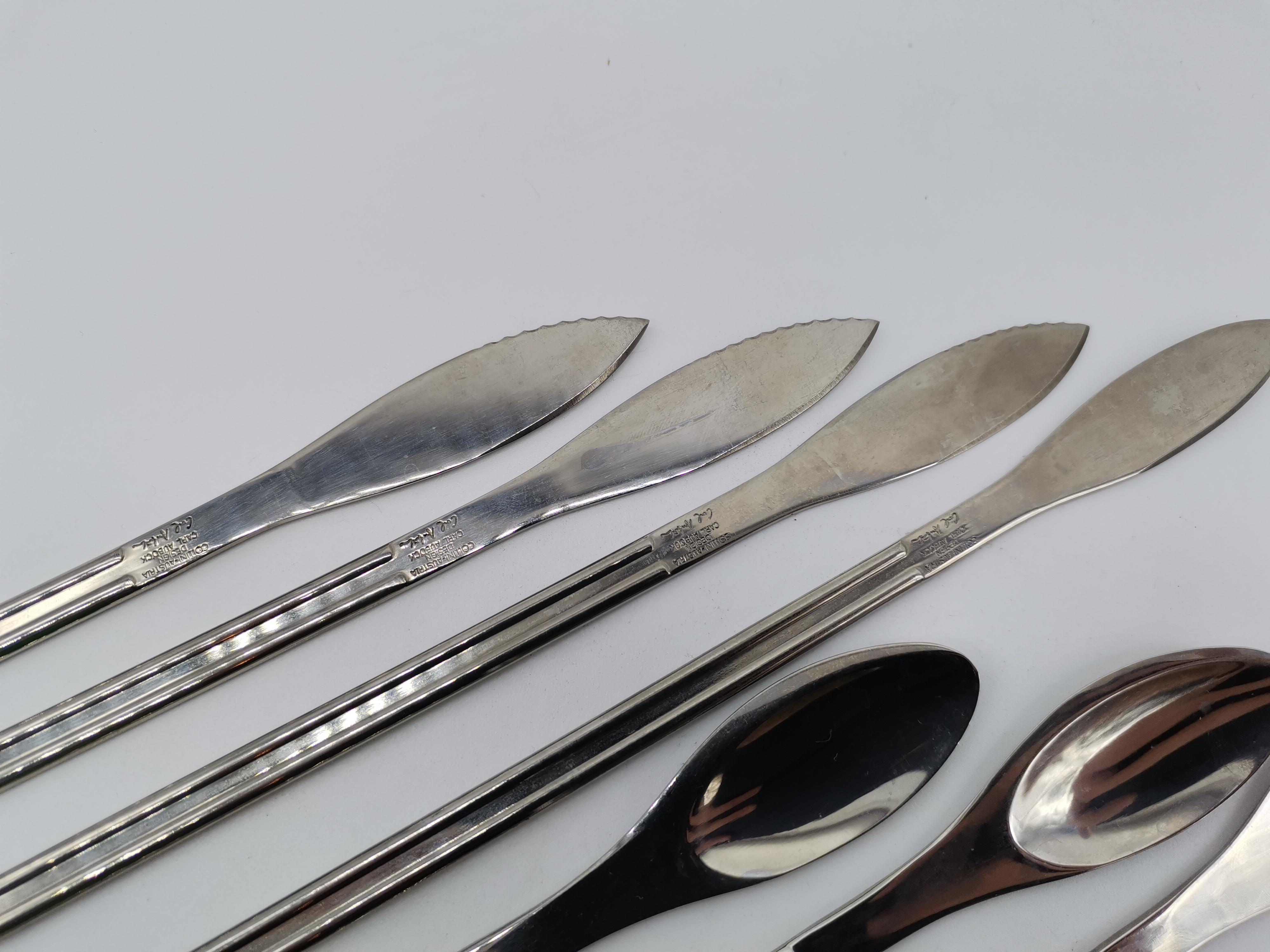 12 pieces of dining cutlery by Carl Auböck. Containing 4 forks, 4 knives, and 4 spoons.