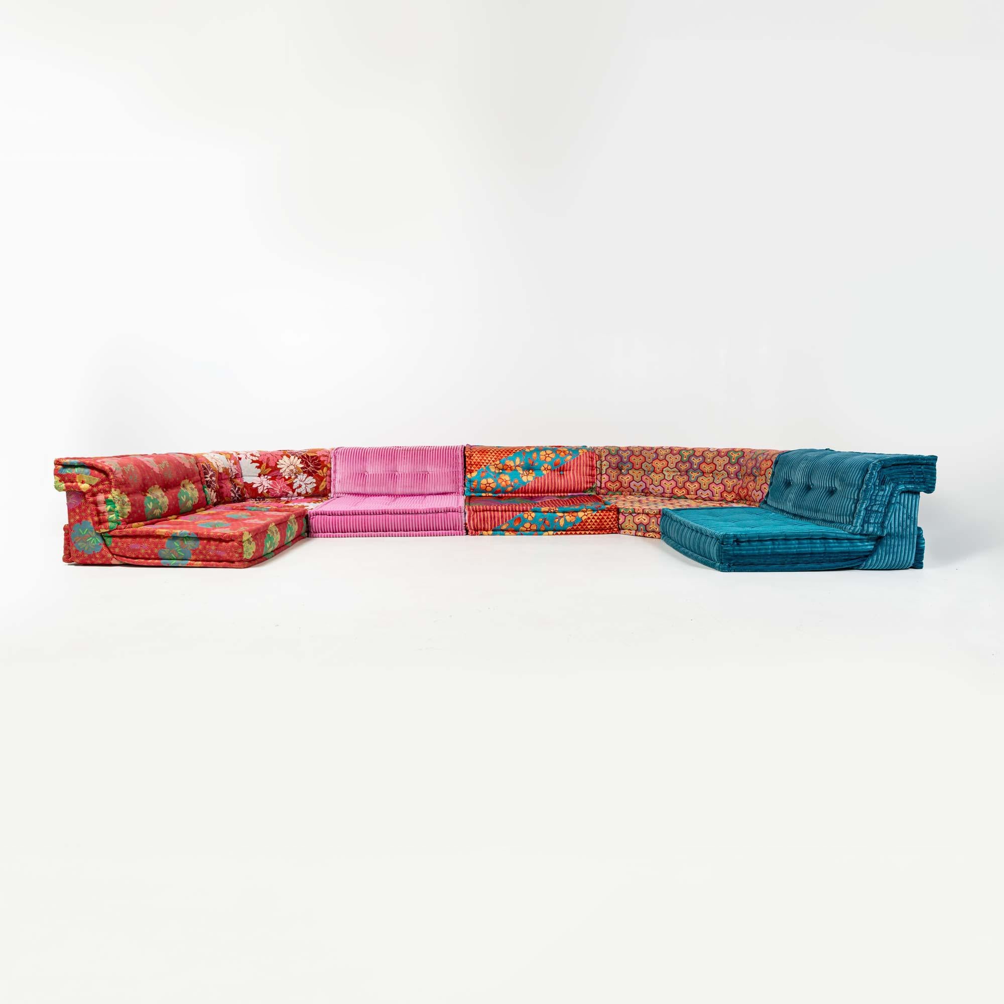 A  12 pieces Mah-Jong sofa designed by Hans Hopfer for Roche Bobois. The set is in good condition, with light wears on some pieces. No rips on fabrics, no color blotching and some wears on some of the base pieces. The set has been cleaned and ready