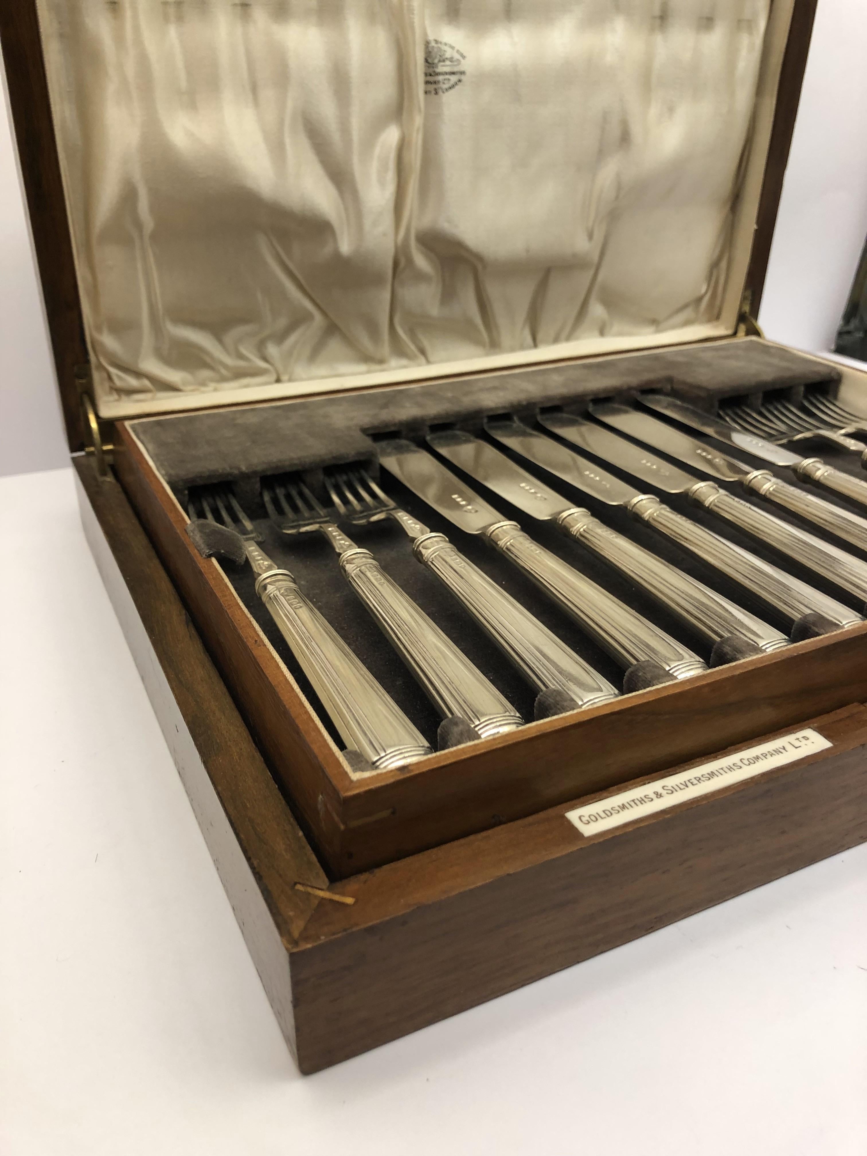 English 12 Piece Silver Cutlery Set by Goldsmiths & Silversmiths, London For Sale