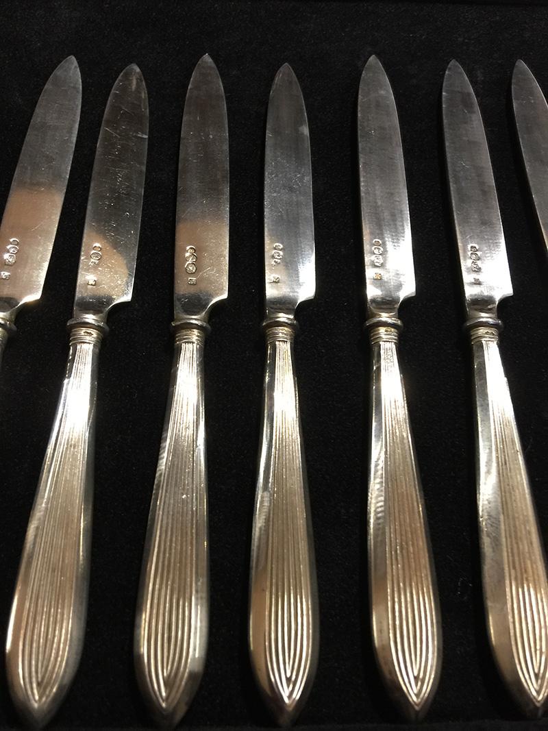 12 pieces rib model silver fruit knifes, Netherlands, 1920

By Kempen & Zonen Fa. J.M. van
1858-1924, Voorschoten
The blades of the knifes are marked with the Dutch silver hall marks:
The Year letter K = 1920
