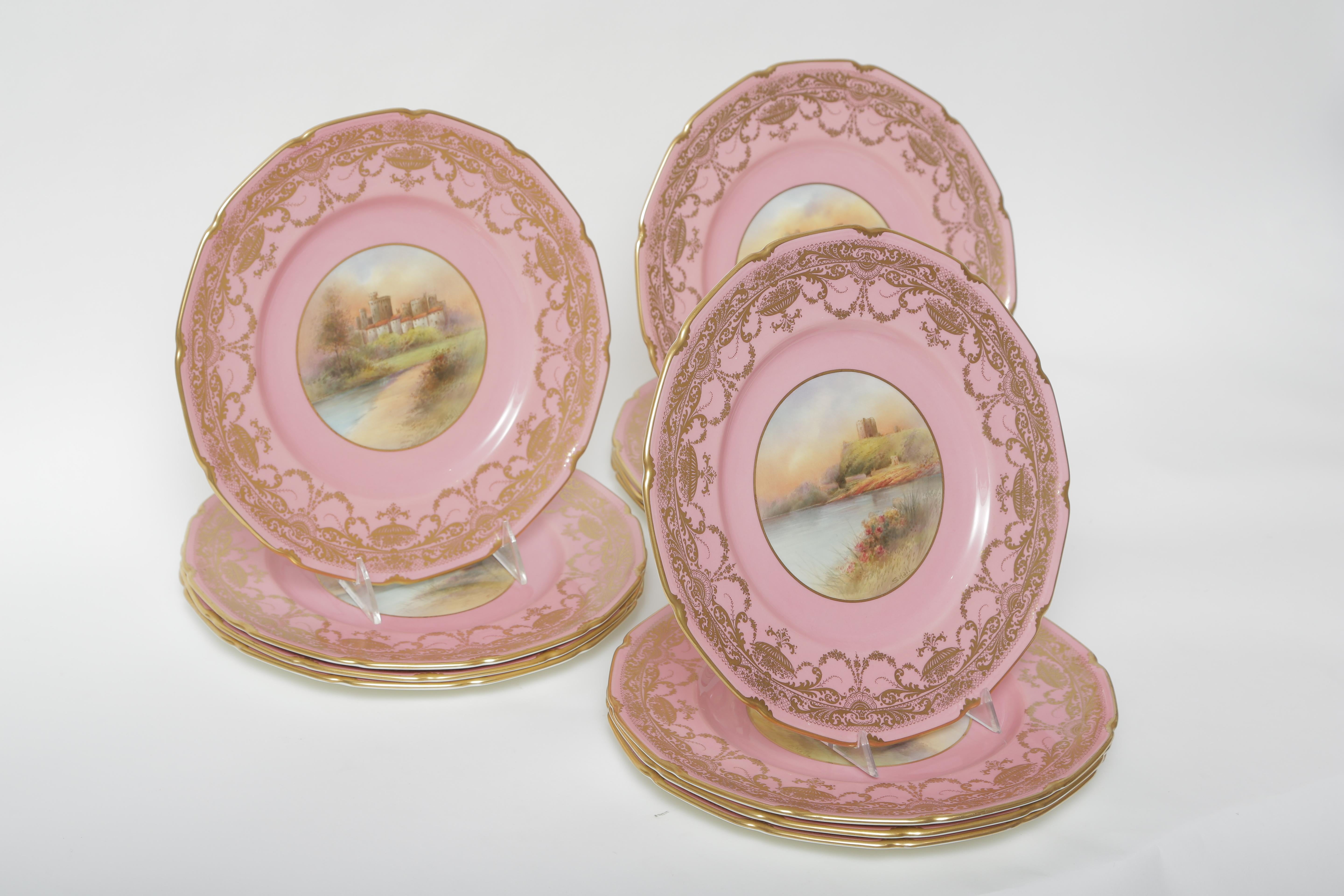 Britannique 12 assiettes de cabinet château roses dorées et peintes à la main. Ancien artiste anglais signé en vente