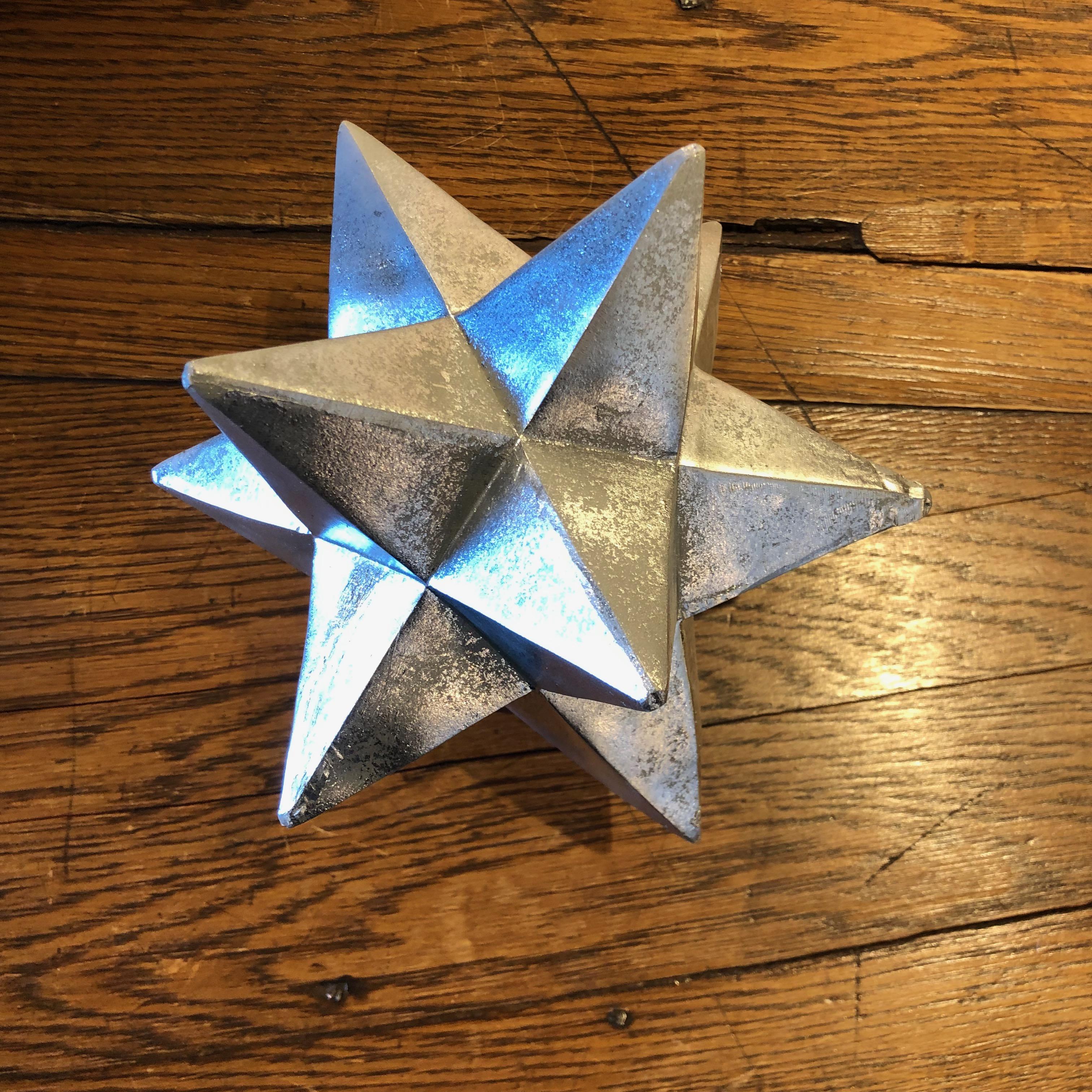 The perfect tabletop decor! This 12-point silver painted resin star will look amazing on any table.
Measures: 7” x 7” x 7”