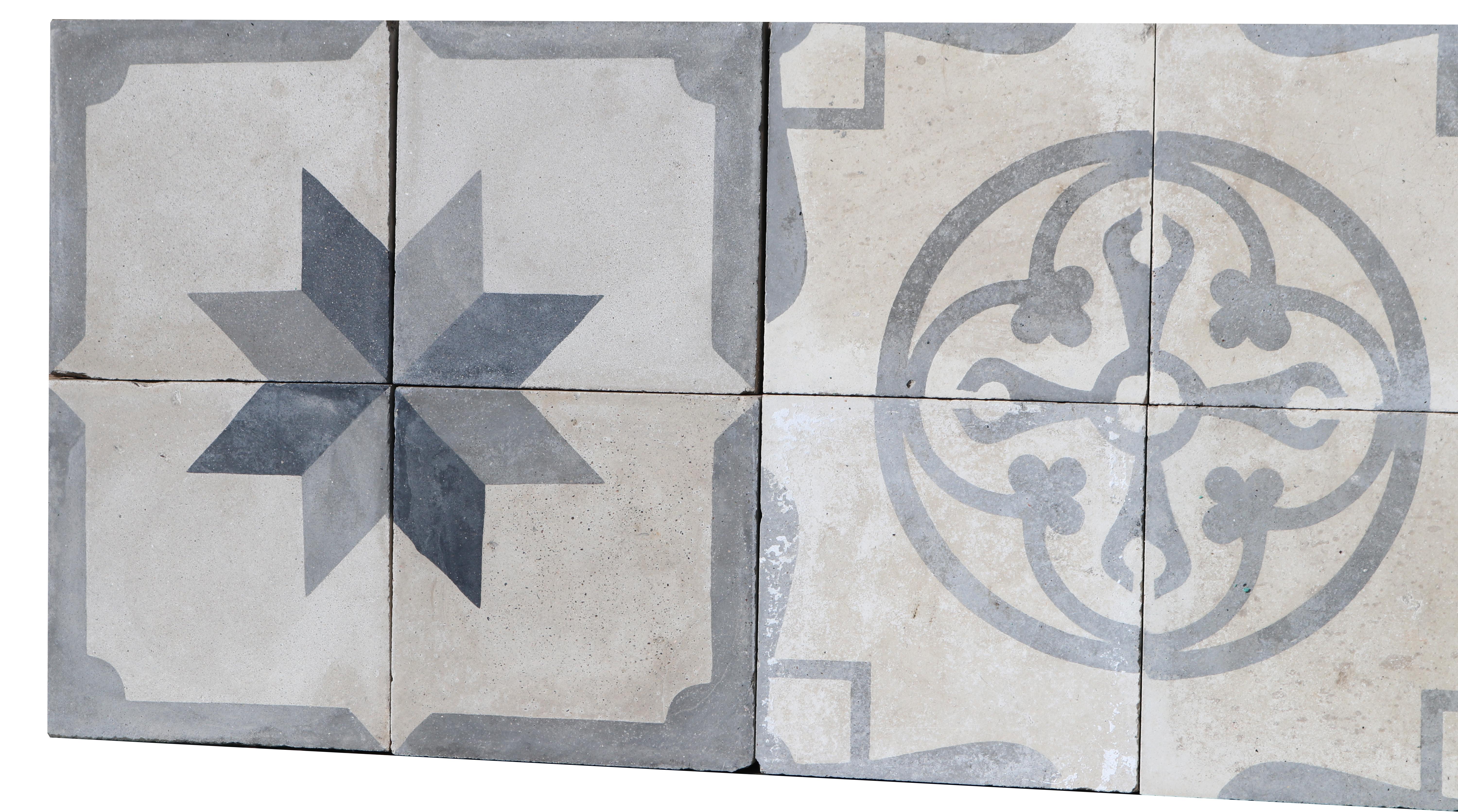 A set of 12 reclaimed encaustic cement tiles. Suitable for use on floors or walls. We think this set would make a great feature splash-back.