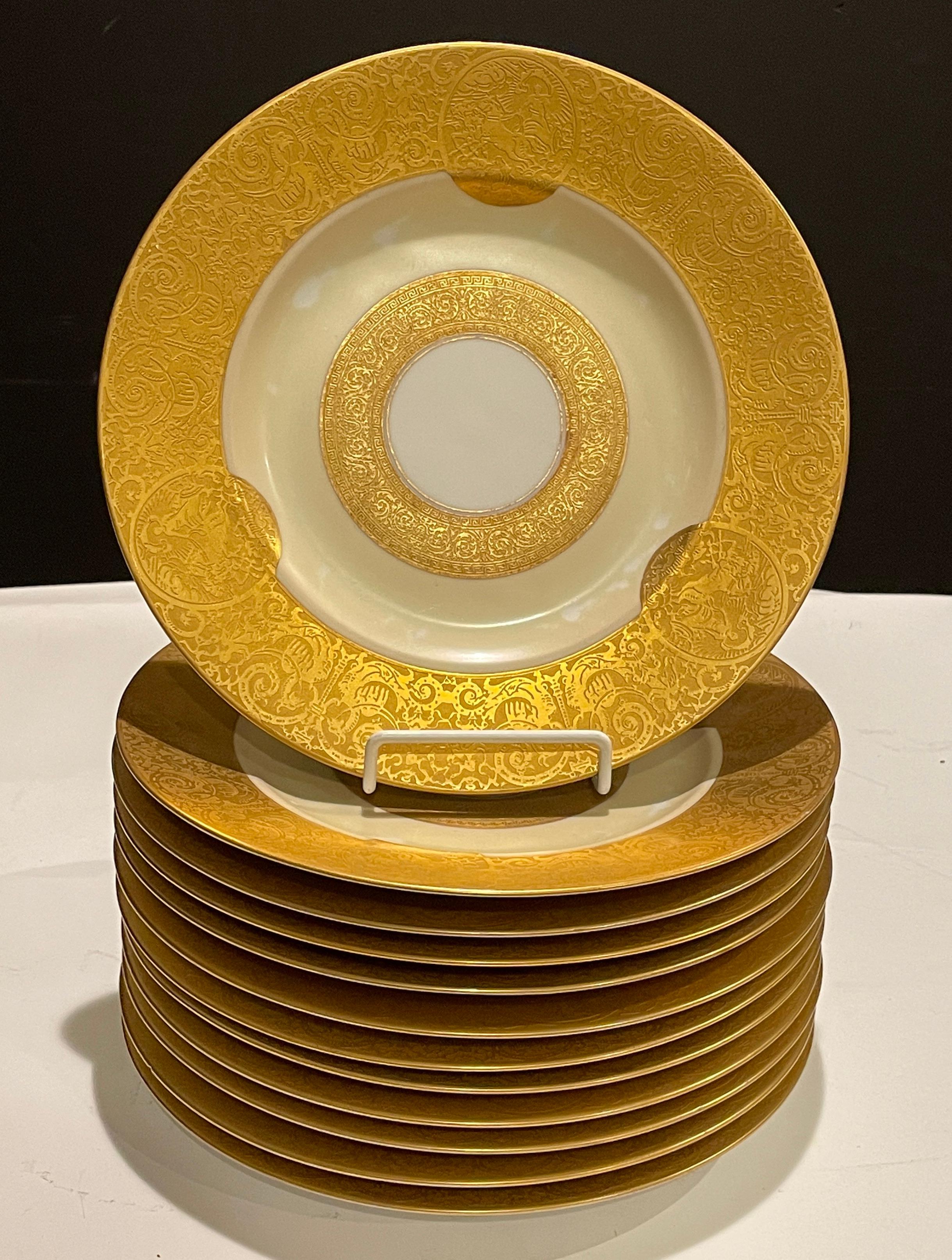 Set of 12 dinner plates with exceptional design featuring heavy raised gilding with images of chariots and mythological Griffin's or Gryphon. Marked Royal Bavarian Hutschenreuther Selb Bavaria.