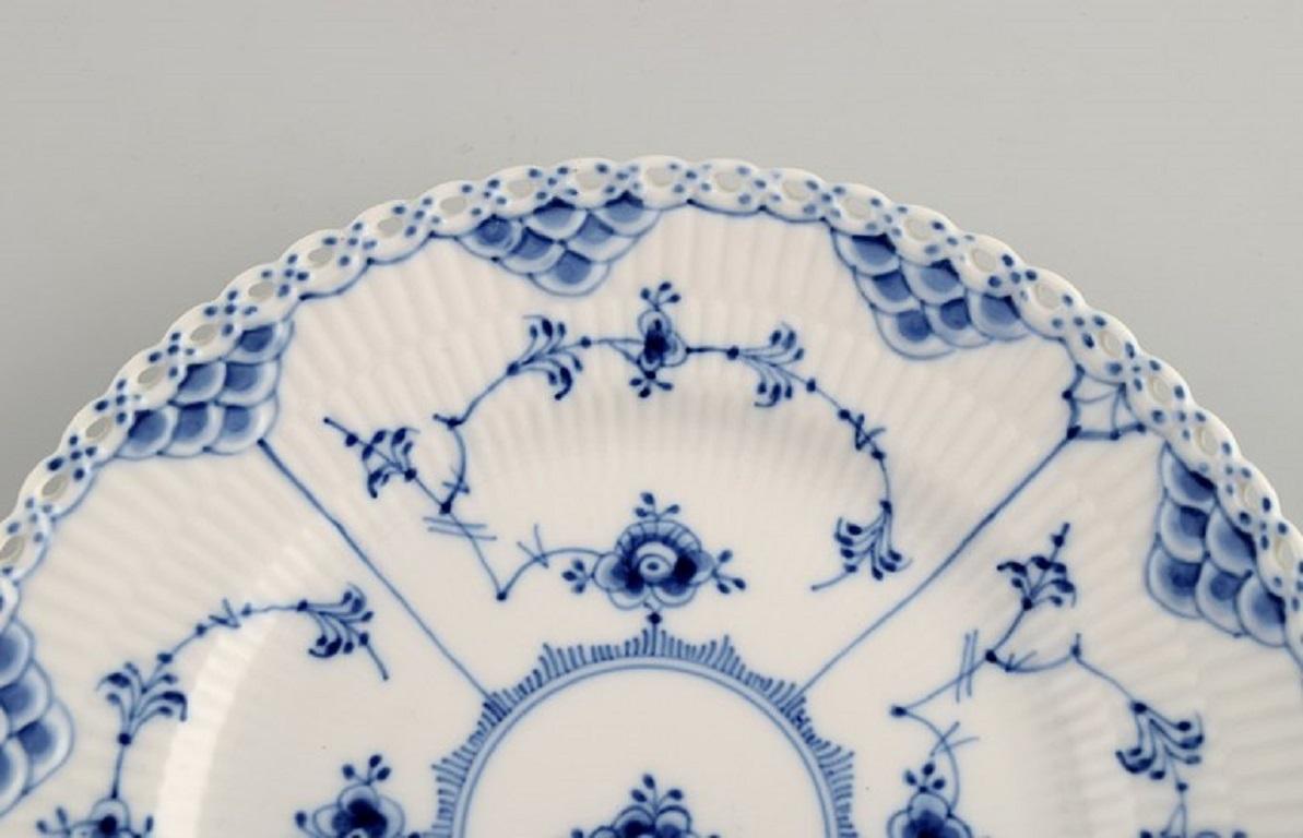 Hand-Painted 12 Royal Copenhagen Blue Fluted Full Lace Plates. Model number 1/1087.