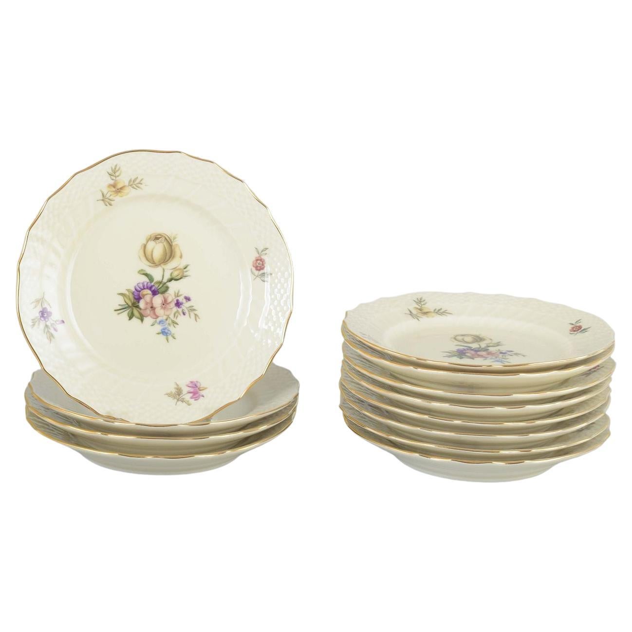 12 Royal Copenhagen Frijsenborg plates in porcelain.
