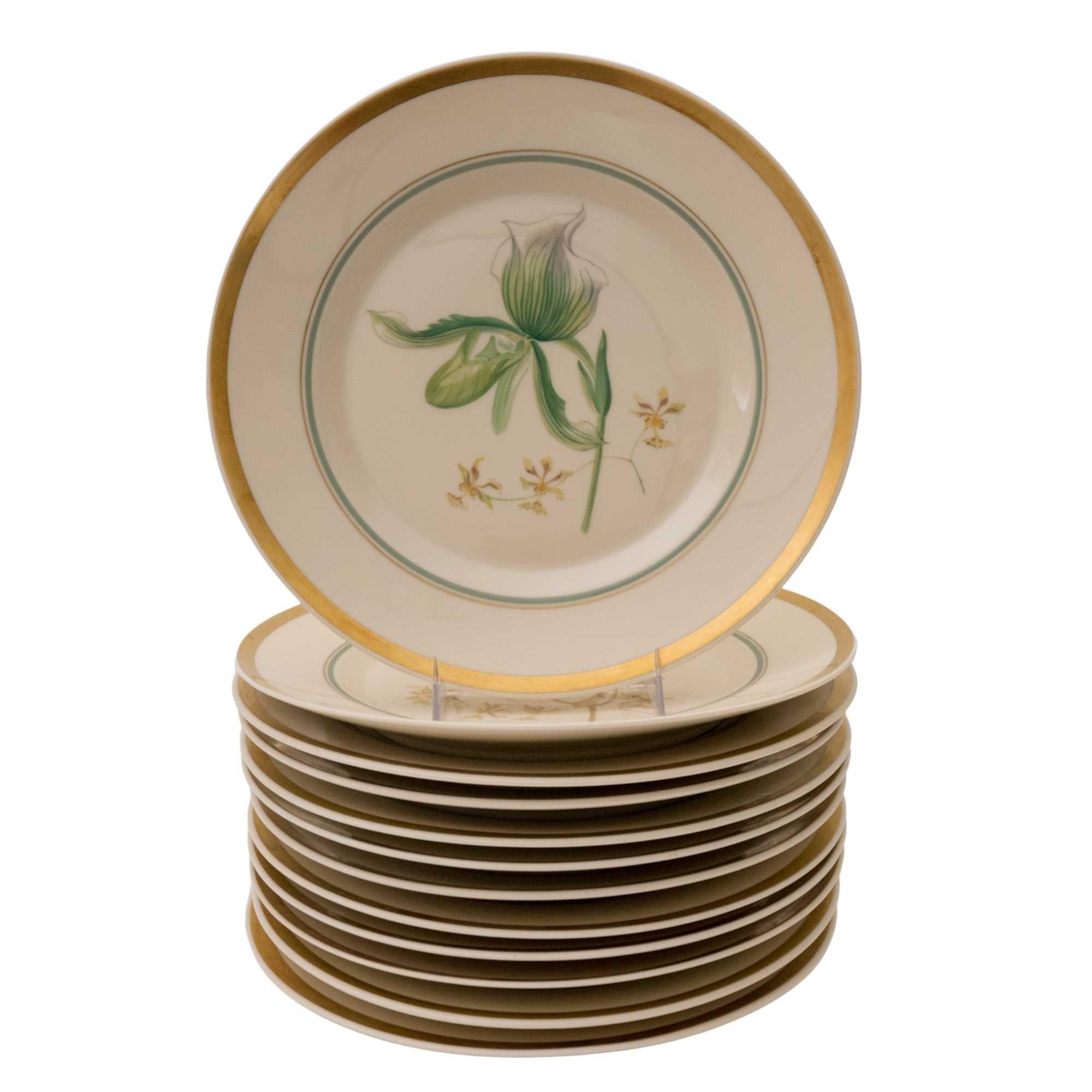 From the storied Danish firm re known for their Flora Danica pattern, we have a set of 12 hand painted and beautifully designed plates. Each orchid species is identified on the back on the fully hall marked plate. A pretty green accent band has been