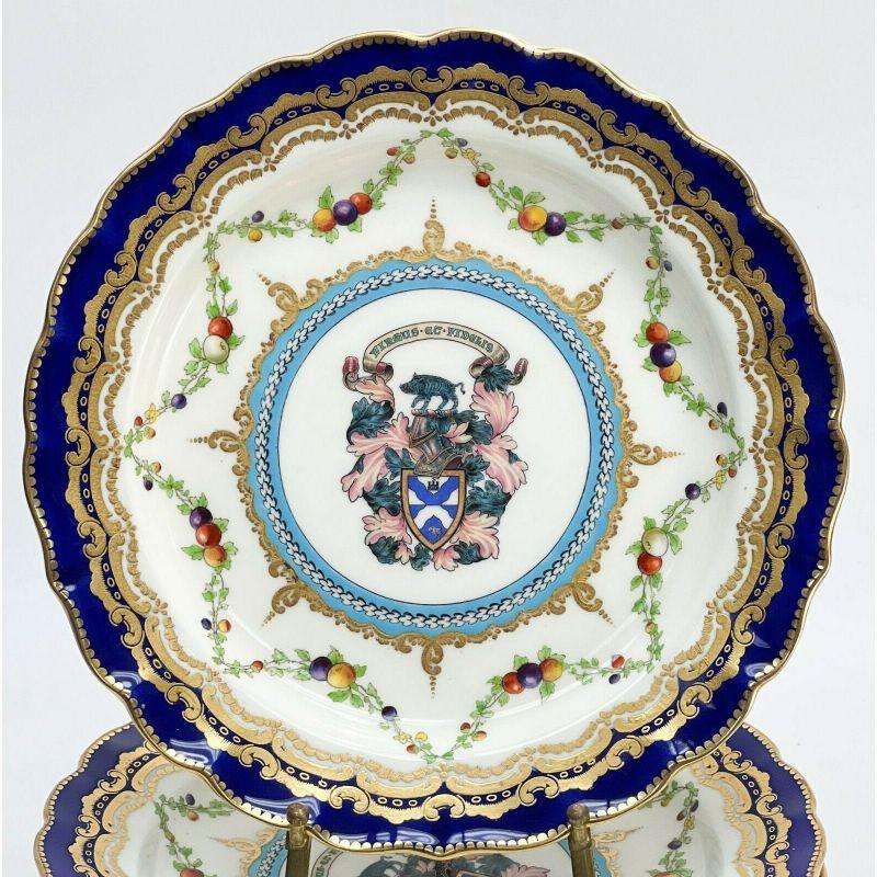 12 Royal Worcester Hand Painted Porcelain 9 inch armorial plates, 1909

Amorial crest featuring a boar, a knight head, leaves, and the motto 