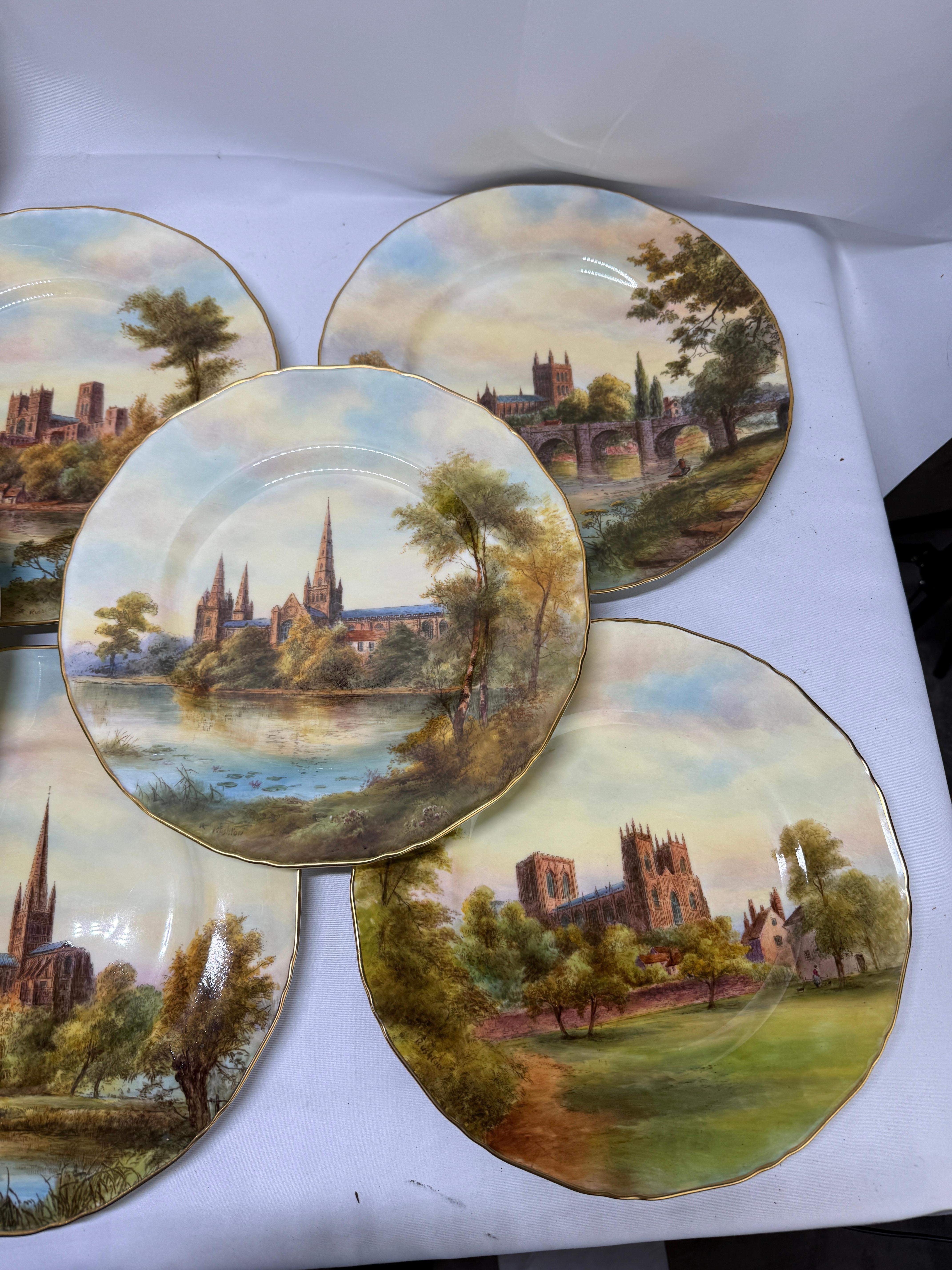 A complete and highly refined set of twelve Royal Worcester porcelain cabinet plates, each individually hand-painted by Raymond Rushton (British, fl. early–mid 20th century), one of the factory's leading architectural painters of the wartime and