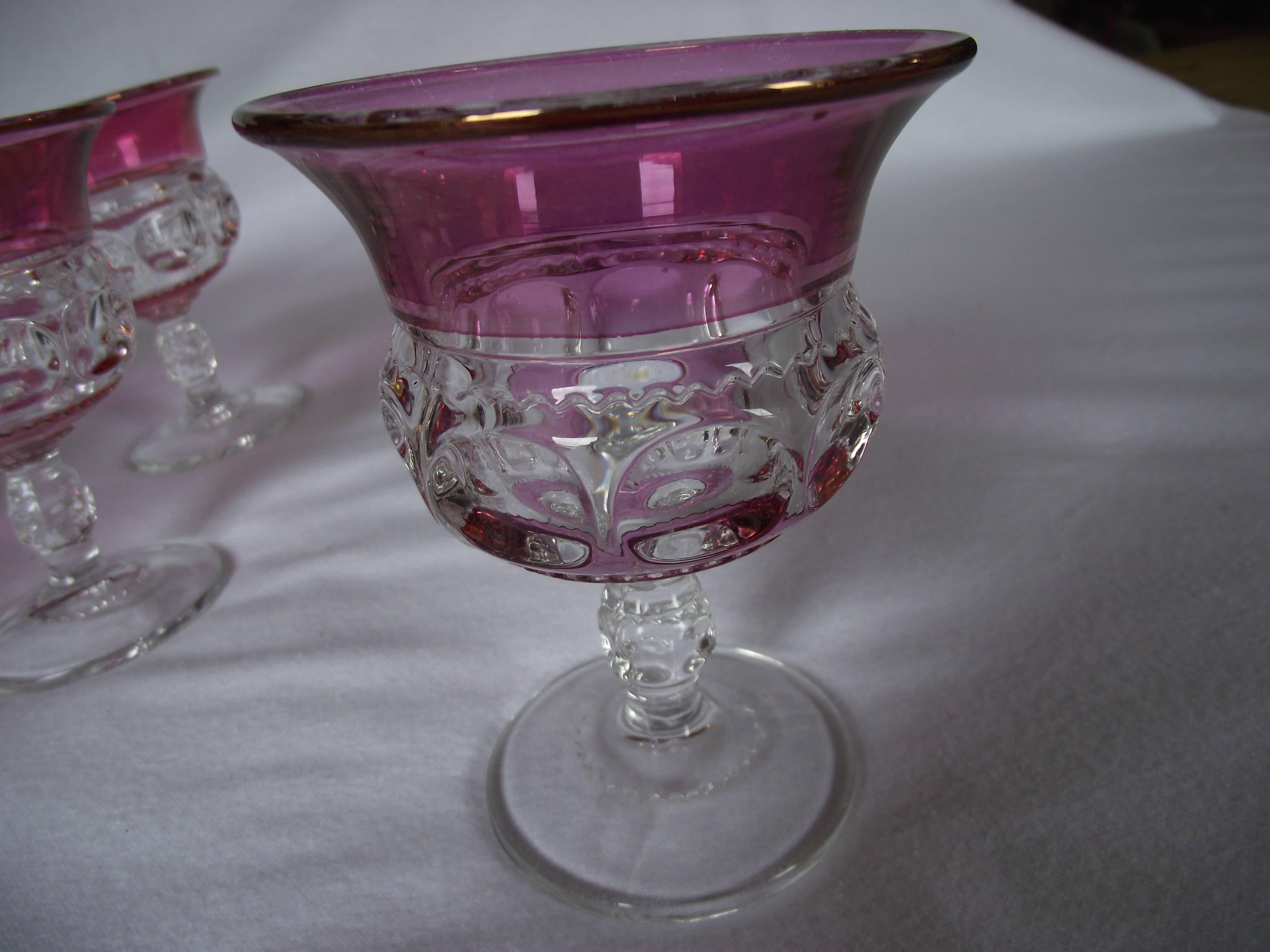 Set of 12 ruby flashed goblets. Very good condition. One glass has slight color loss. No chips.