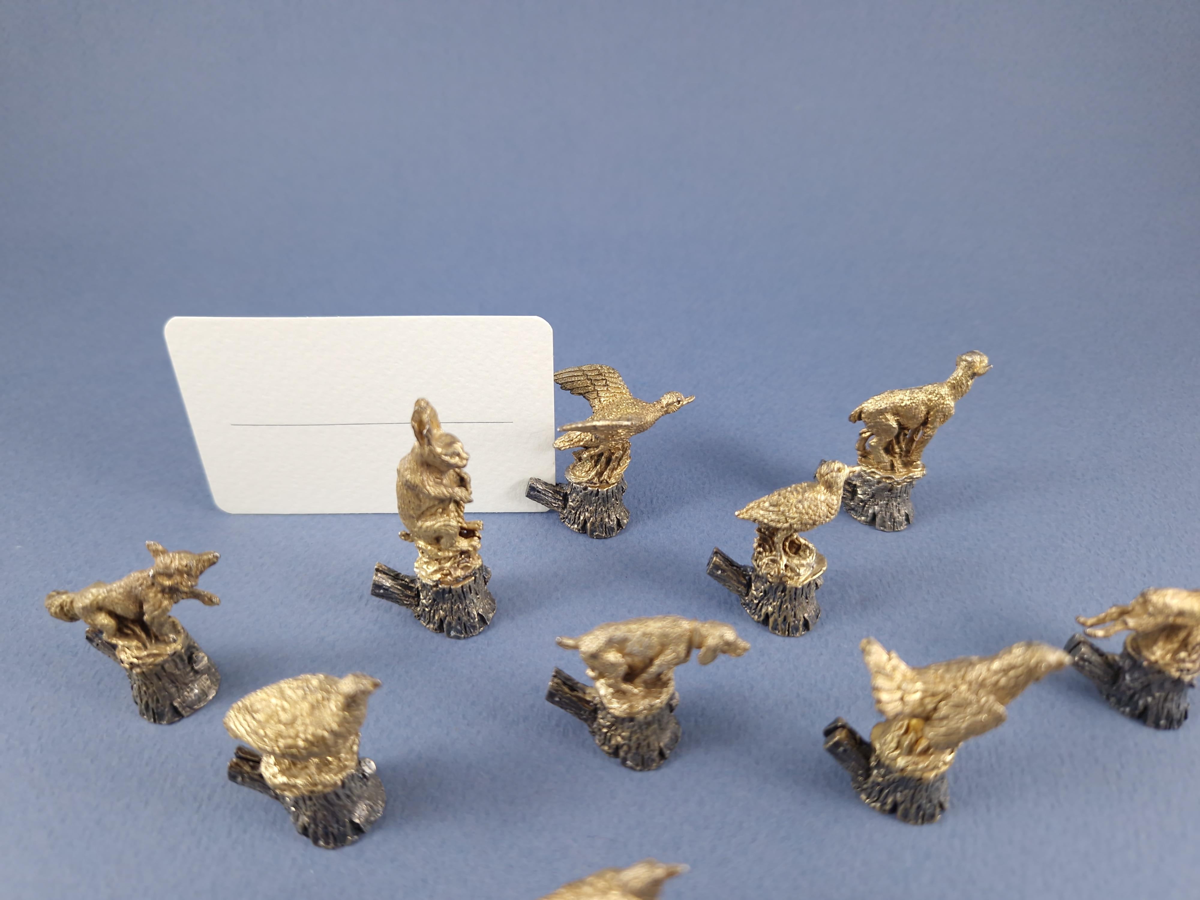 Beautiful set of 12 Solid Silver Place Card Holders and gilt decorated with animals on a wooden trunk 

800 Silver hallmark 
Silversmith: Bartolini Bartolozzi 

Height between 2.9 and 4.8 cm  (between 1.14 inches and 1.89 inches)
Weight: 204