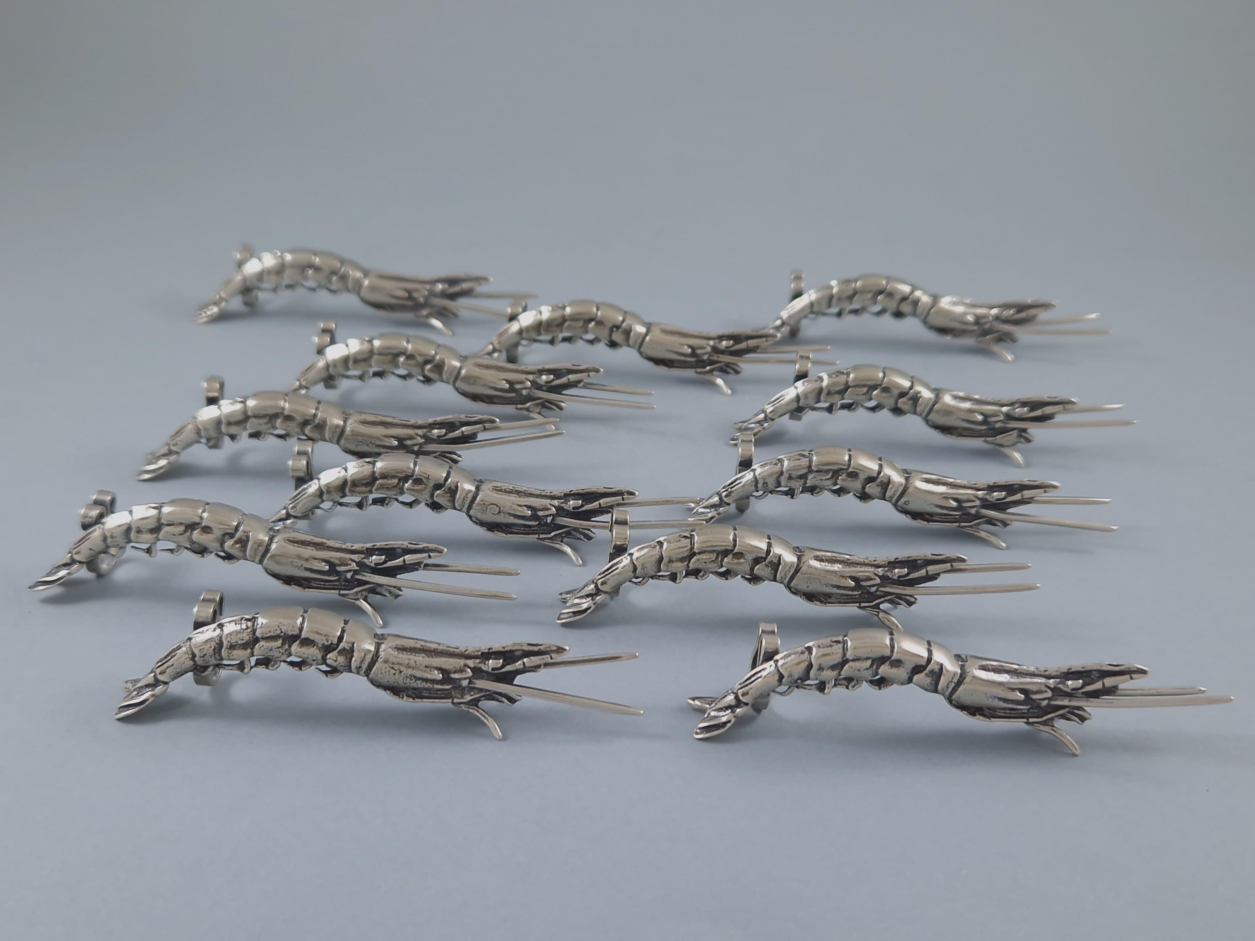 Set of 12 sterling silver place card holders in the shape of crustaceans
800 silver hallmark 
Length: 8.3 cm - 3.26 inches
Height: 1.8 cm - 0.7 inches
Weight: 270 grams
In perfect condition