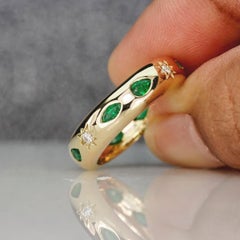 12 Stone Flush Set Ring Features 8 Emeralds & 4 Star Set Natural Diamonds