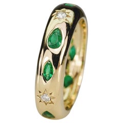 12 Stone Flush Set Ring Features 8 Emeralds & 4 Star Set Natural Diamonds