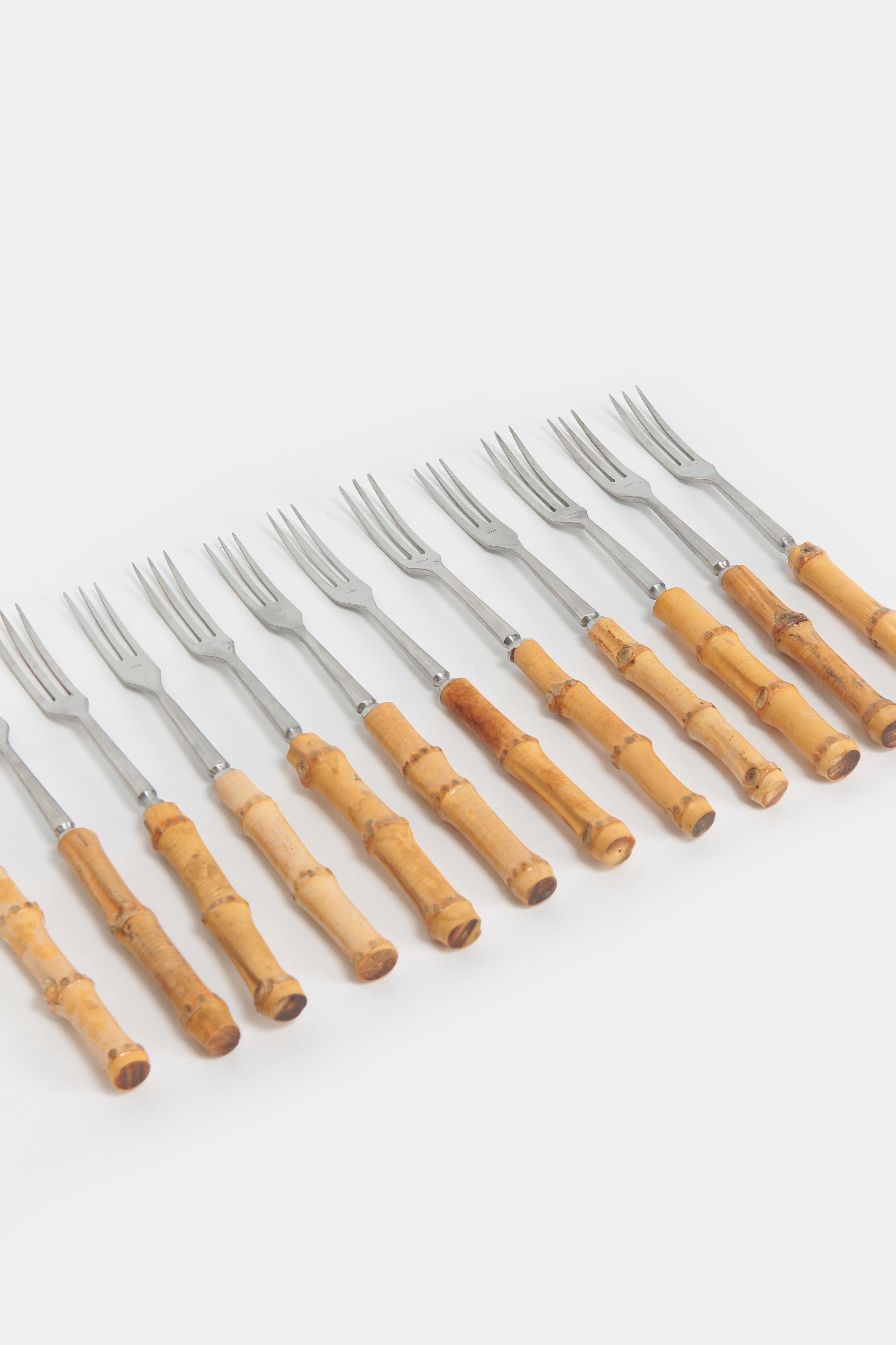 12 Swiss fondue forks made of chrome steel with bamboo handles made in the 1950s. Marked with INOX on the front.