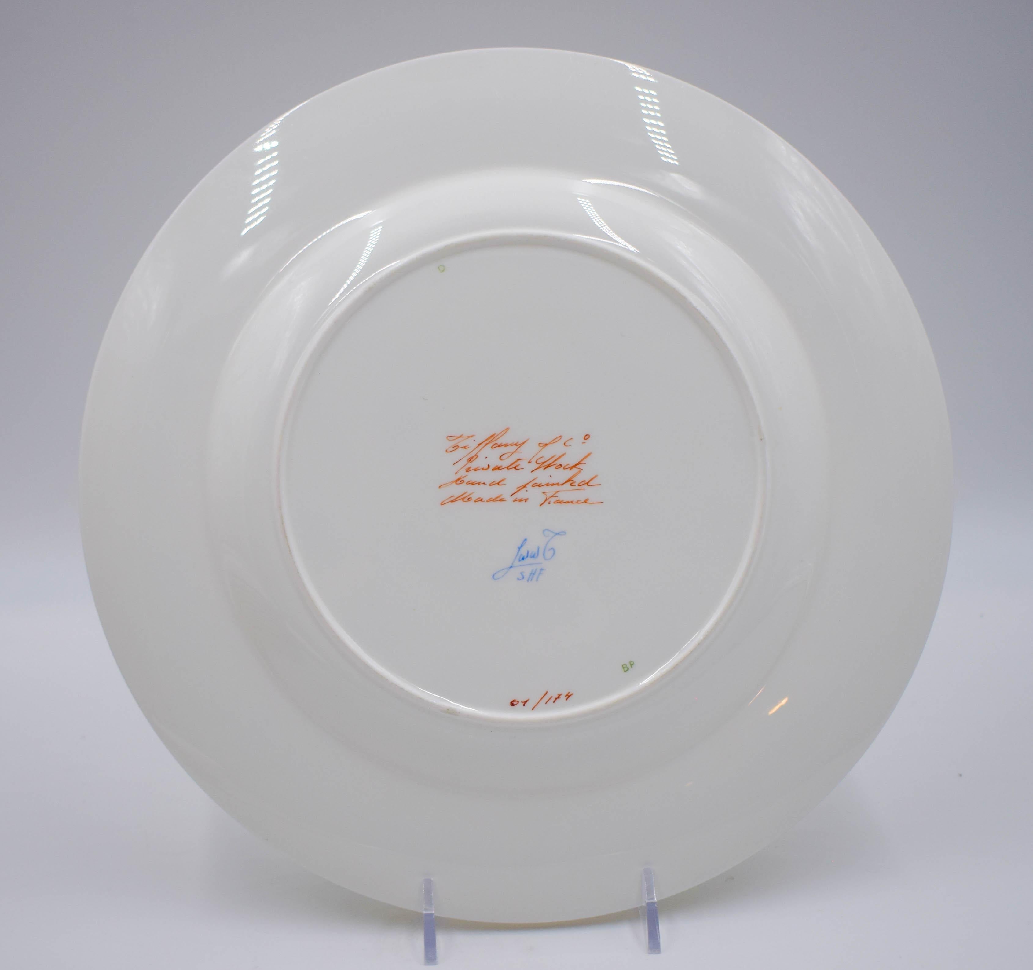 This set of twelve Tiffany Le Tallec Private Stock porcelain dinner plates was made for the prestigious luxury goods firm Tiffany & Co. Produced in France and dating to the mid-20th C., each plate is hand-painted with blue morning glories on a white