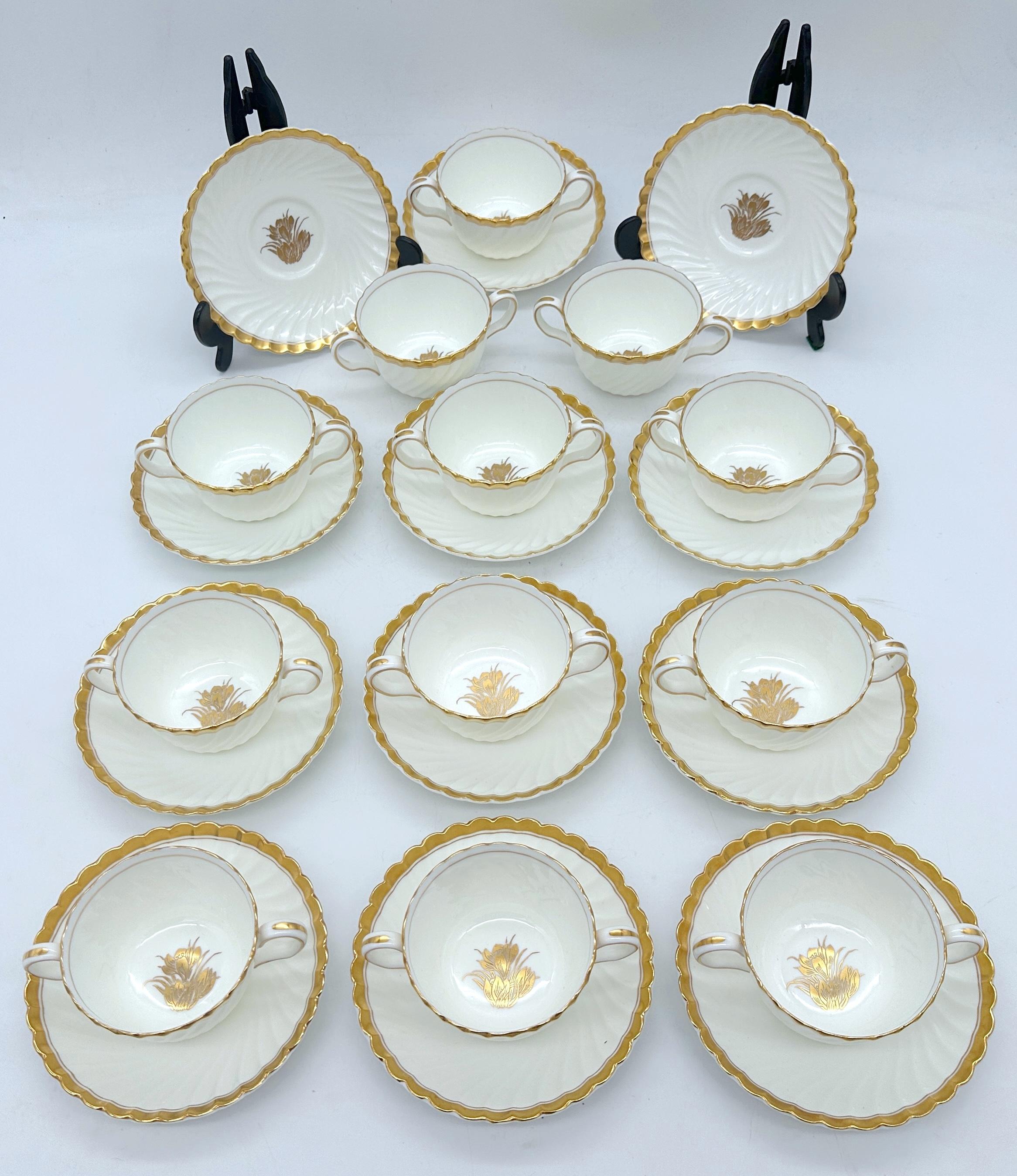 12 Tiffany & Company Mintons 'Gold Crocus' Pattern Twin Handled Cups & Saucers, England Circa 1950 

This exquisite set of 12 Mintons 'Gold Crocus' twin-handled cups and saucers is a rare find, showcasing one of Mintons' most iconic and sought-after