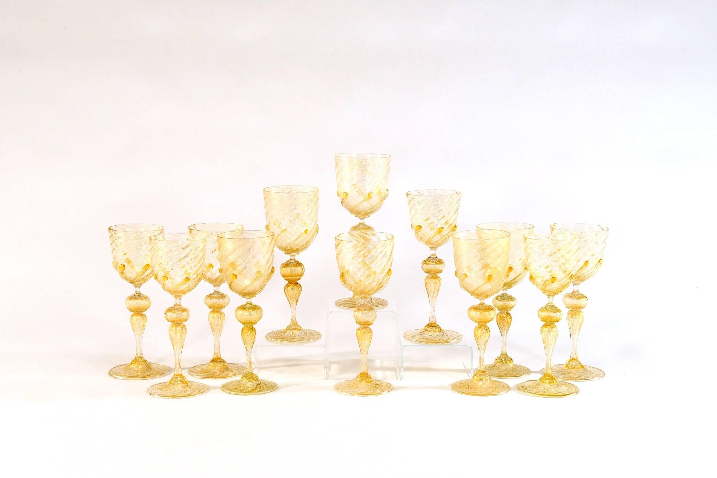 Offering an amazing set of 12 wine goblets that will be the talking point of your dinner conversation. These hand blown goblets scream gold! Clear glass filled with gold leaf and standing 9