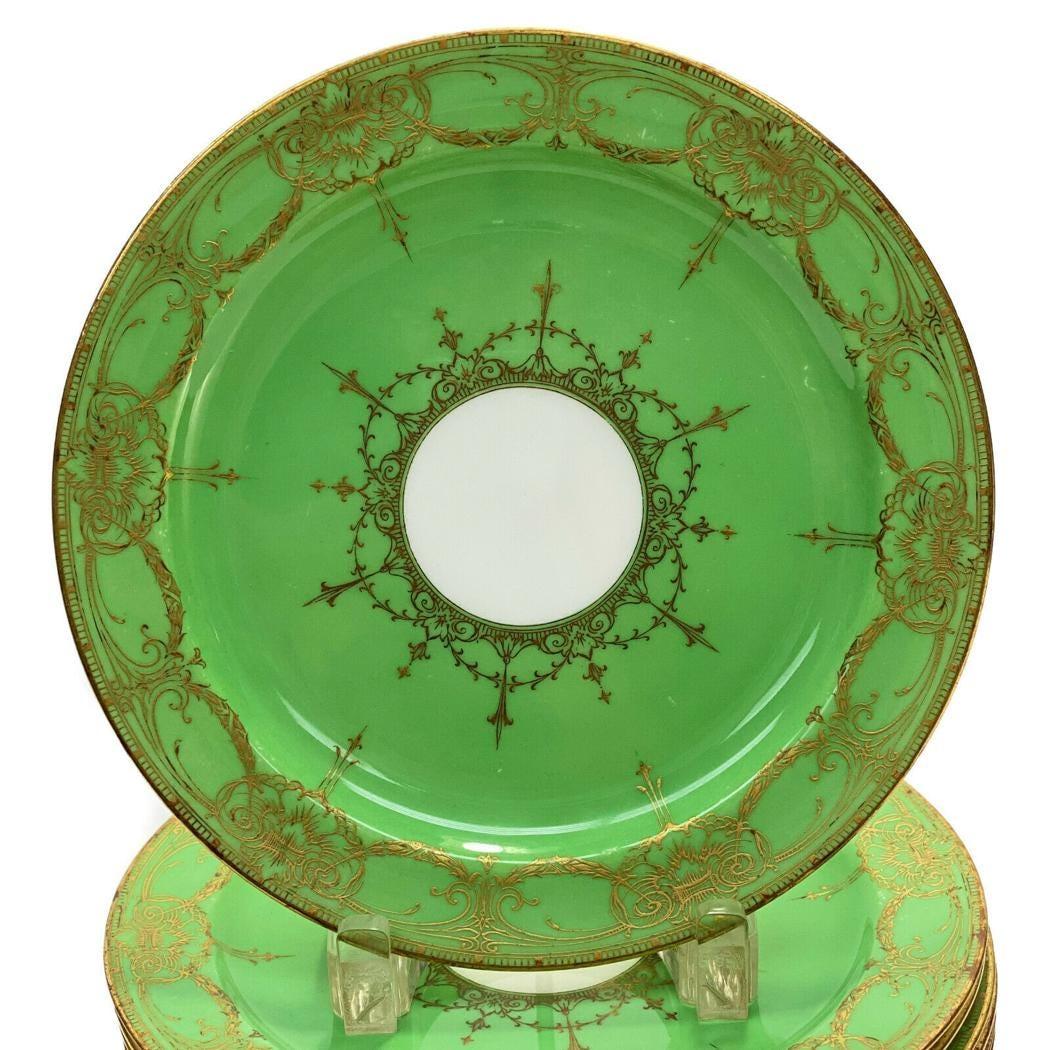 An antique Royal Worcester England set of 12 pretty apple green dessert or salad plates. These will add a nice pop of color to your table top selection. They feature an all over gilt foliate swag design. In very nice antique condition.