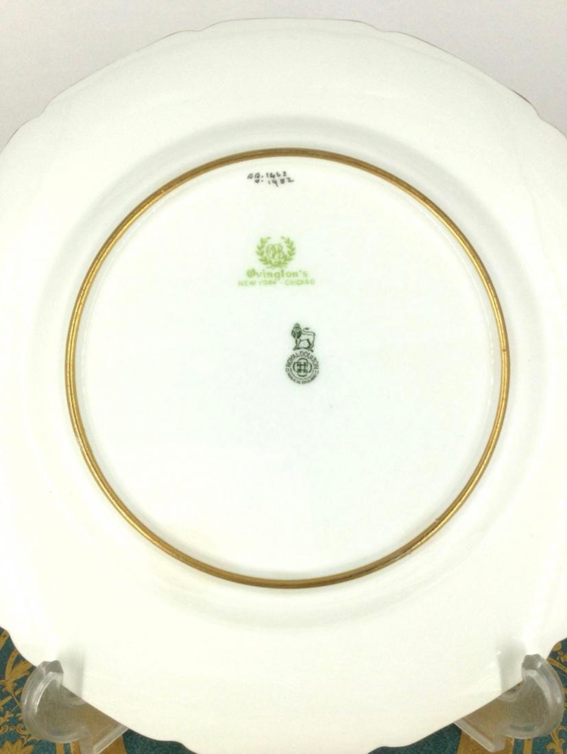 An unique set of antique dinner plates custom ordered through the fine Gilded Age retailer Ovington Brothers New York. A classic shape designed by Robert Allen for this re known English porcelain manufacturer features intricate raised gold