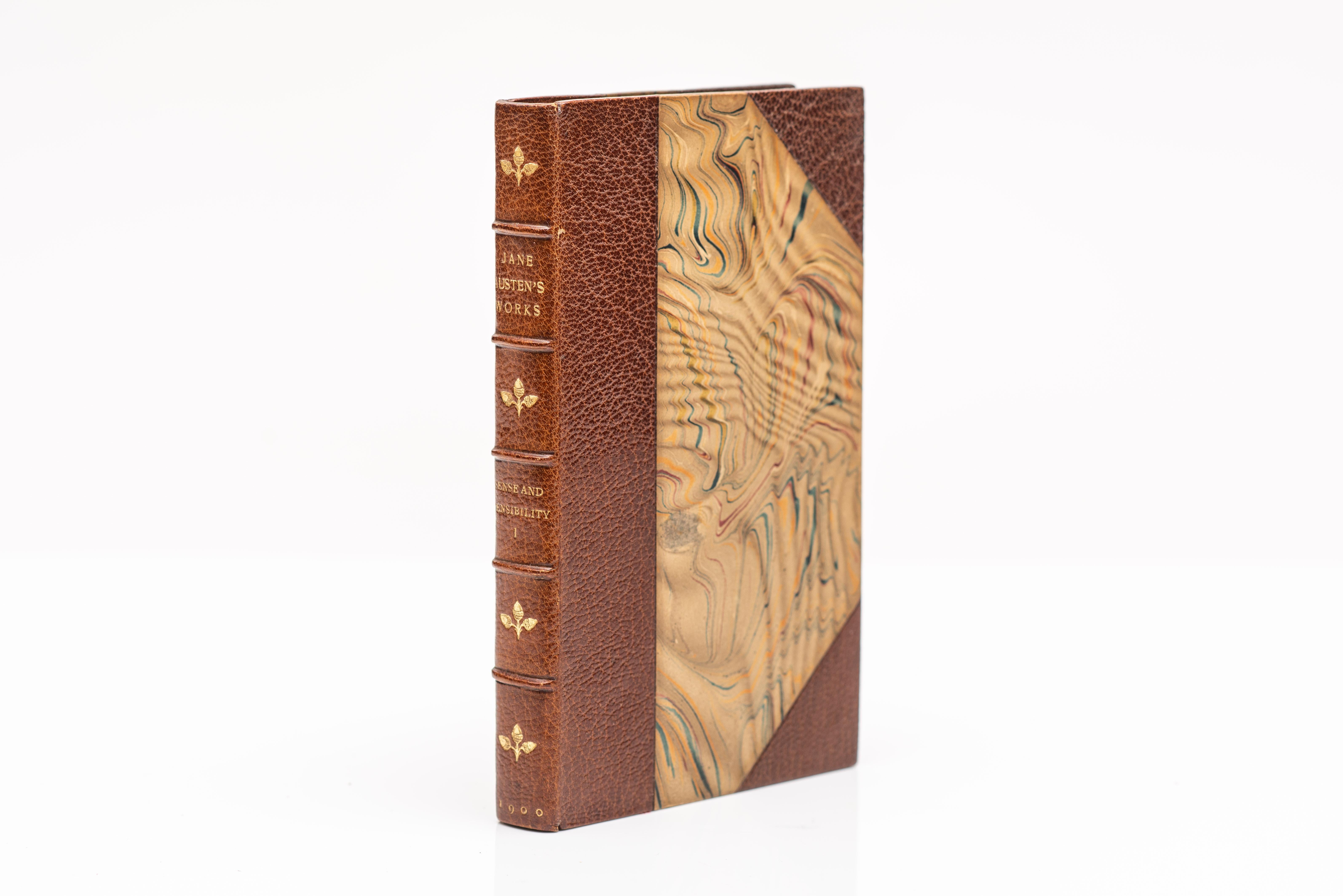 12 Volumes. Jane Austen, The Novels. Bound by Blackwell in 3/4 brown morocco with marbled boards. Gilt-tooled decoration on the raised band spines. Top edges gilt. Marbled endpapers. Illustrated frontispiece. Boston: Little, Brown and Co., 1899 -