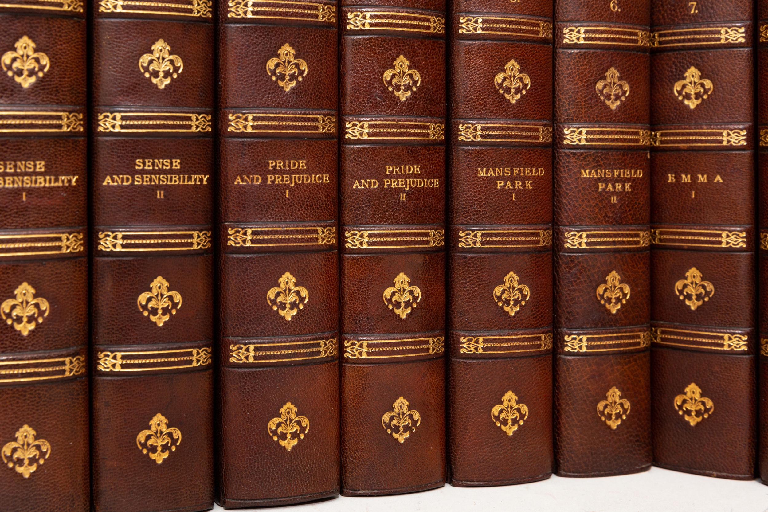 12 Volumes. Jane Austen, The Novels of Jane Austen. Bound in 3/4 tan morocco. Green linen boards. Raised bands. Decorative gilt-tooled symbols on spines. Top edges gilt. Marbled endpapers. Bound by Bayntun. Winchester Edition. Published: Edinburgh;