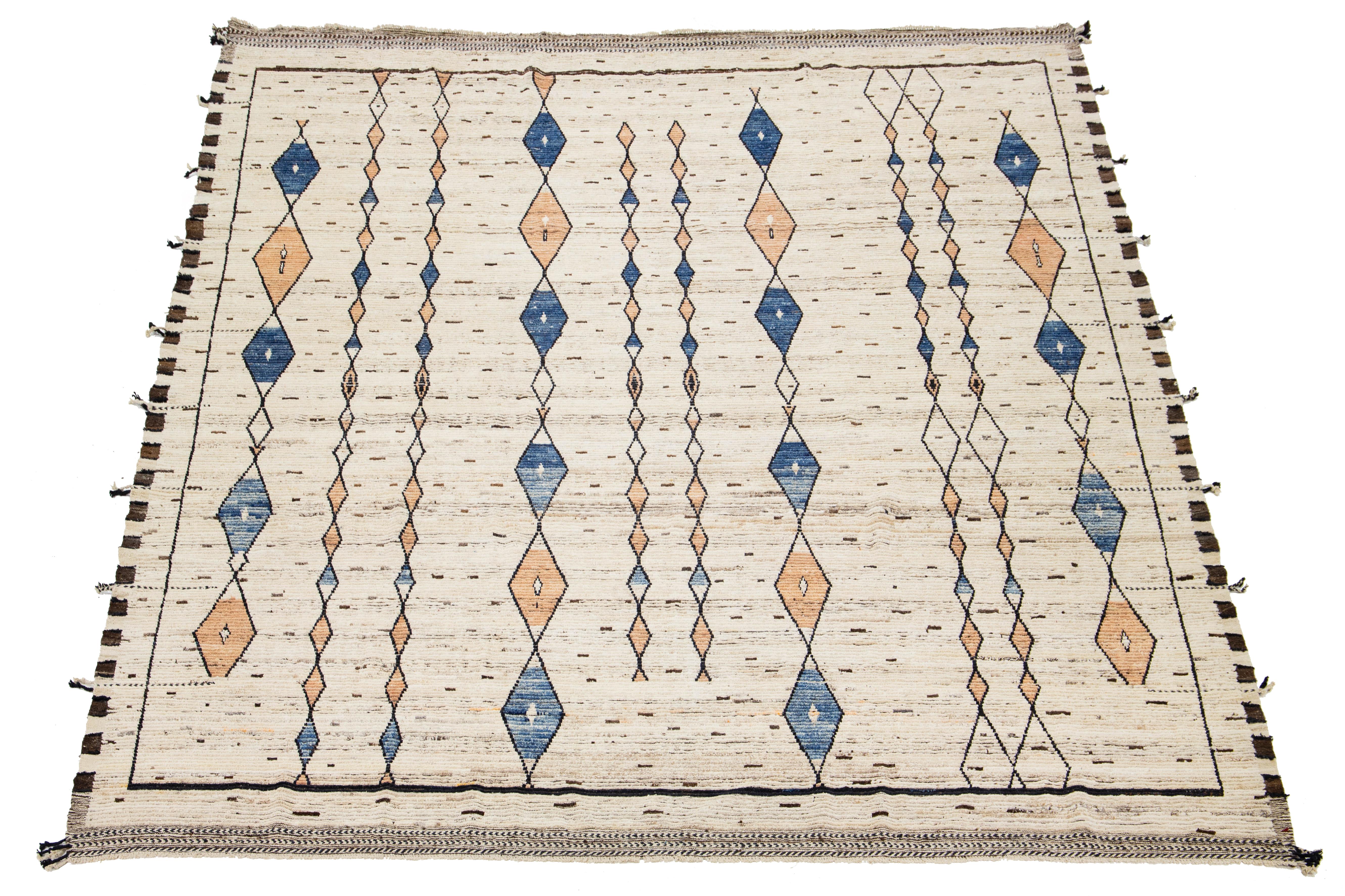 Enhance your space with this beautiful handmade Moroccan-style wool rug. The beige background is beautifully paired with a vibrant multicolor tribal pattern, adding a lively touch to any room. Elevate your decor with this piece that artfully