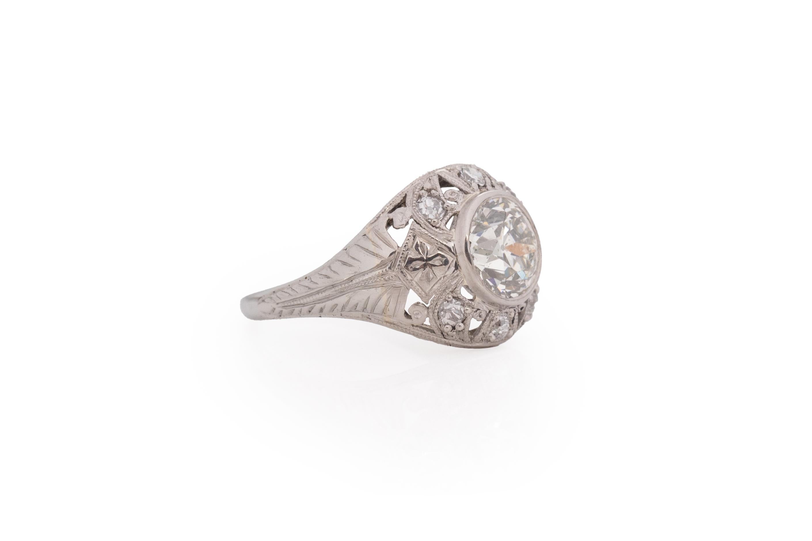 Ring Size: 4.5
Metal Type: Platinum [Hallmarked, and Tested]
Weight: 2.1 grams

Center Diamond Details:
Weight: 1.20 carat
Cut: Old European brilliant
Color: J/K
Clarity: I1

Side Stone Details:
Weight: .15 carat, total weight
Cut: Antique European