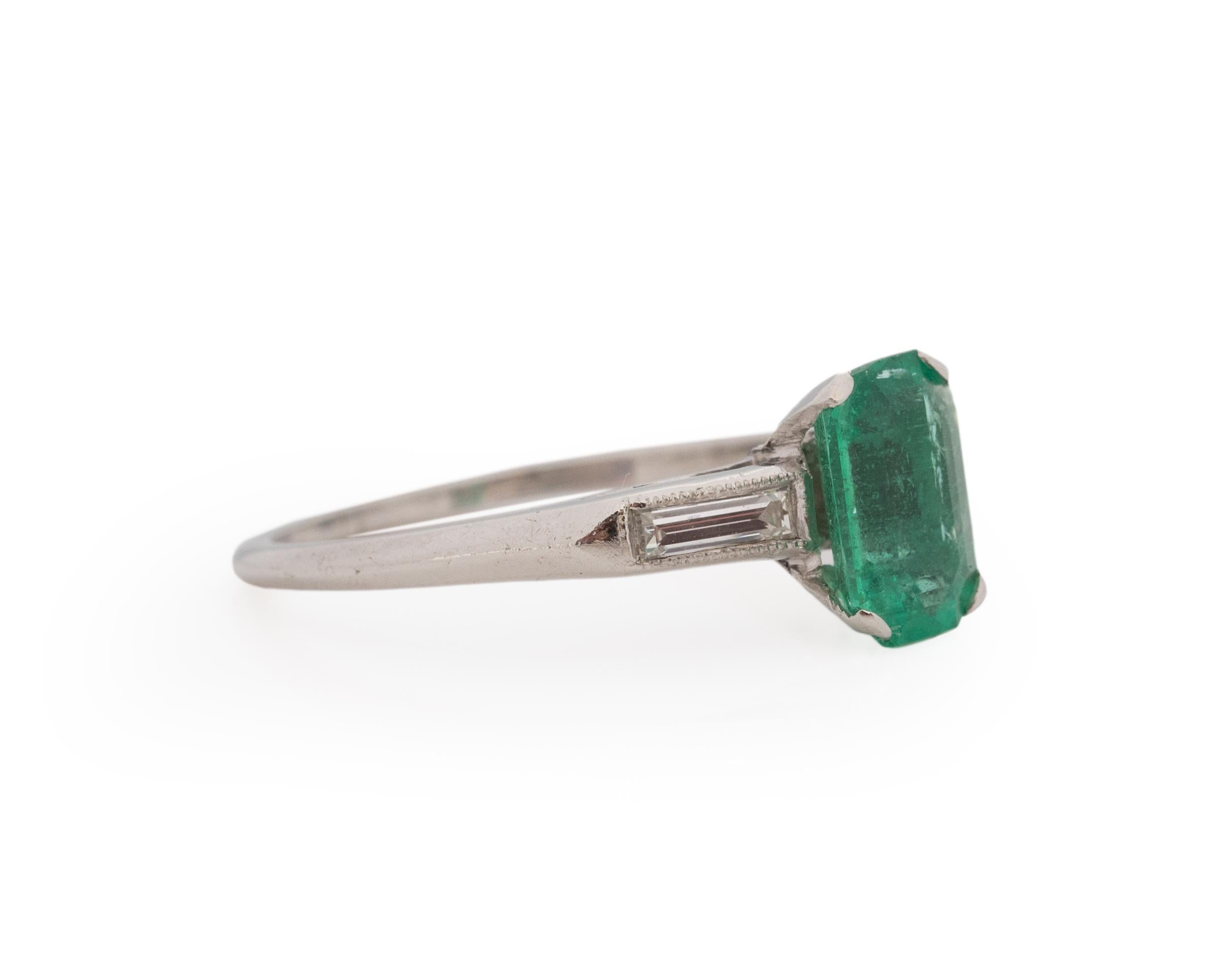 Ring Size: 6.25
Metal Type: Platinum [Hallmarked, and Tested]
Weight: 3.0 grams

Center Stone Details:
Type: Emerald, Natural.
Weight: 1.20ct
Cut: Emerald Cut
Color: Green:

Side Stone Details:
Weight: .25ct, total
Cut: Antique Straight