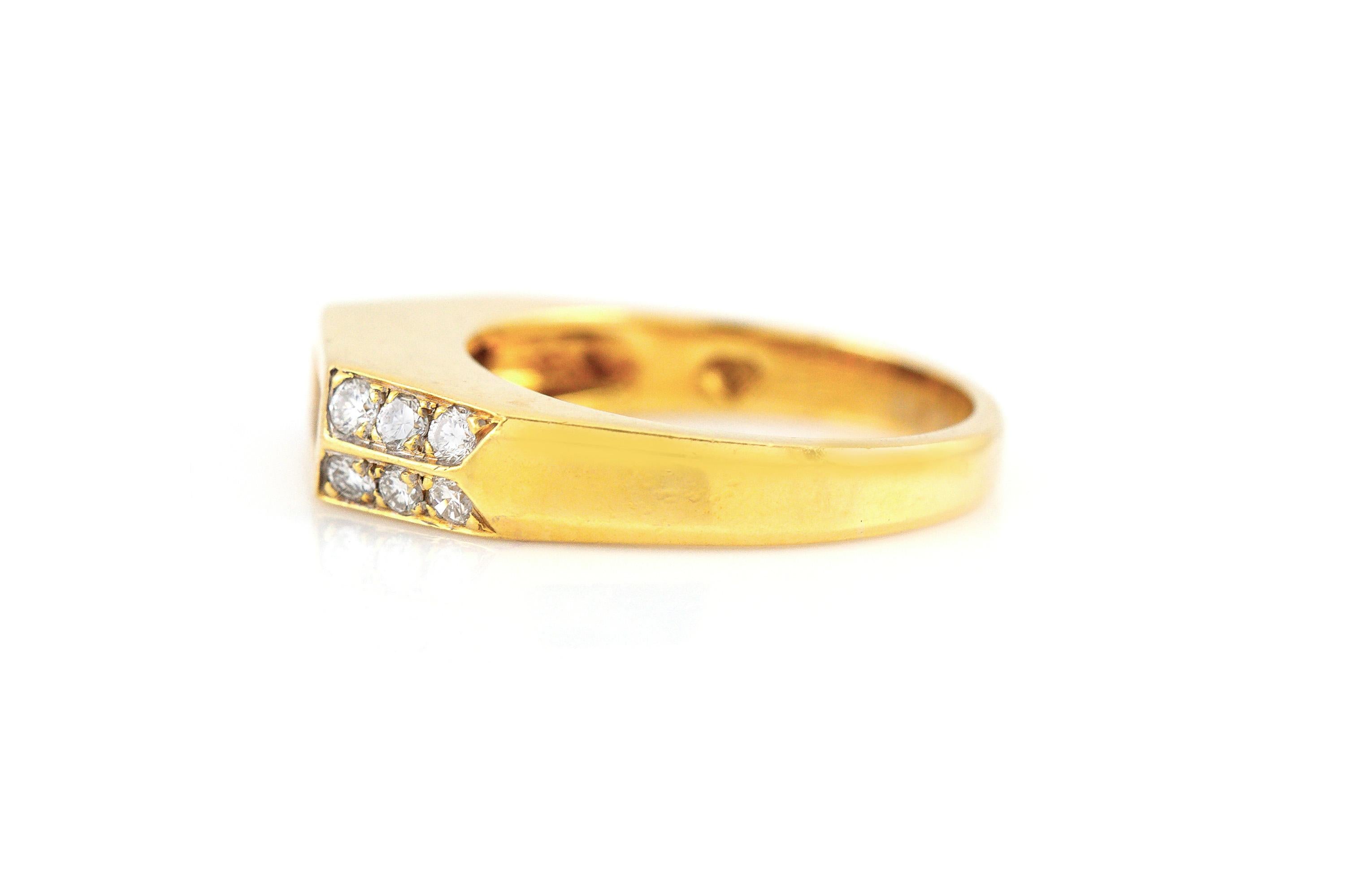 Finely crafted in 18k yellow gold with 4 Baguette and 12 Round brilliant cut diamonds weighing approximately a total of 1.20 carats.
Size 9 1/4, resizable