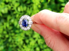 1.20 Carat Basaltic Sapphire 1.28 Carat Diamond Platinum Cluster Ring Circa 1935