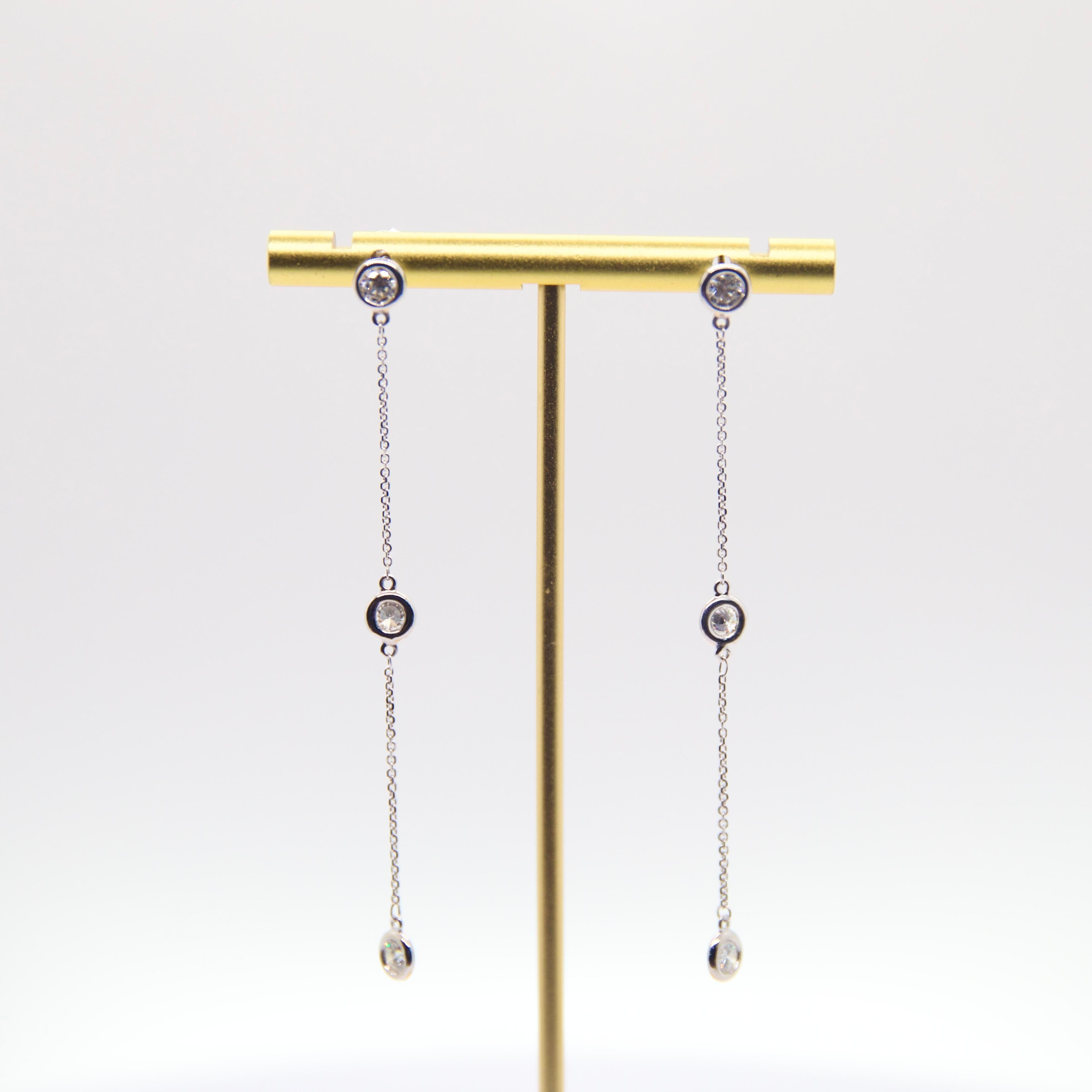0.20 carat each diamond stationed in a 14k white gold bezel

Total weight: 1.20 carat

GHSI1 quality diamond

14k white gold cable chain 

Push back post

3 inch drop

Original designs by Elsa Peretti, this earring is reimagined and made for sole