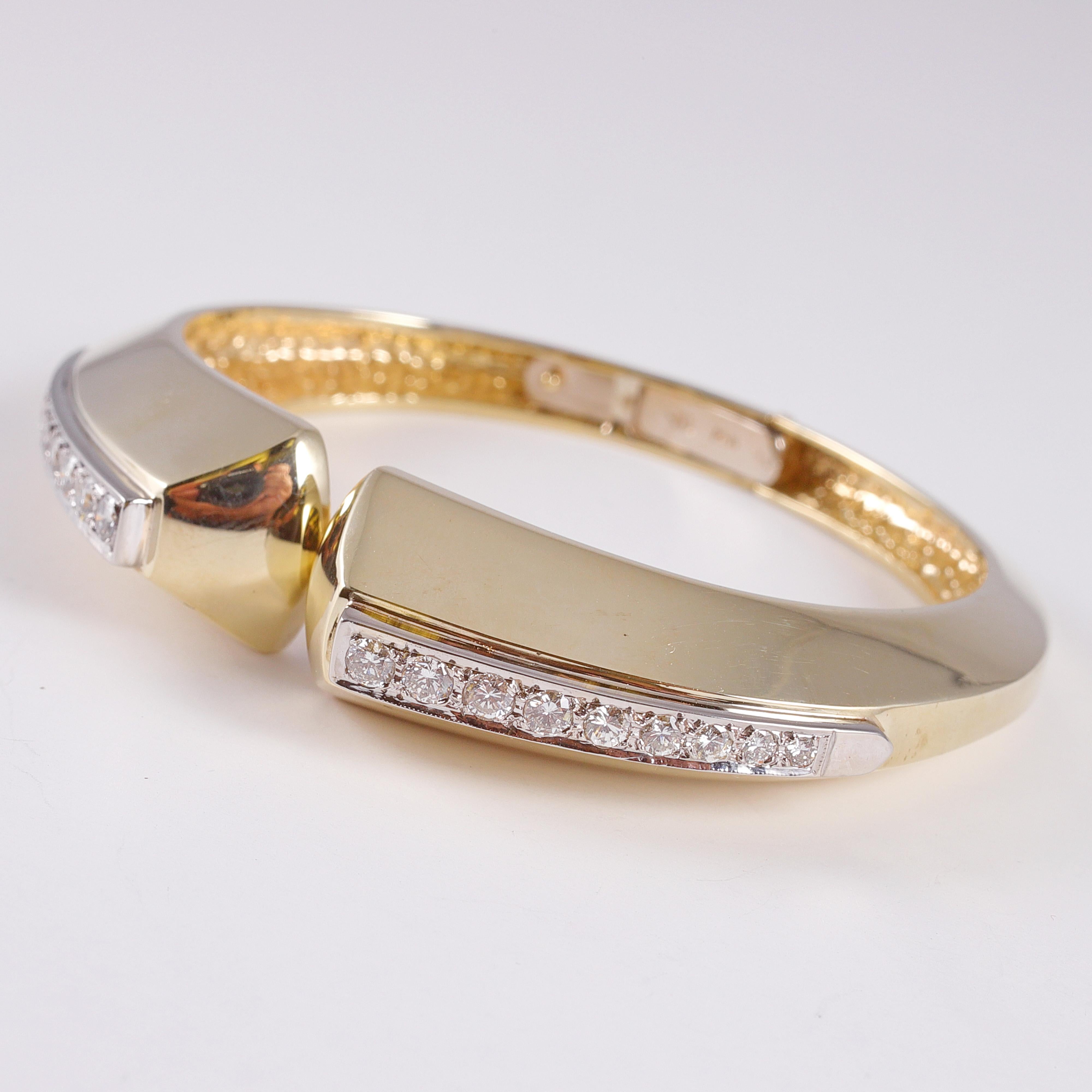 Two toned 14 karat gold hinged cuff bracelet with 1.20 carats of diamonds and polished gold.  This beauty is engraved 