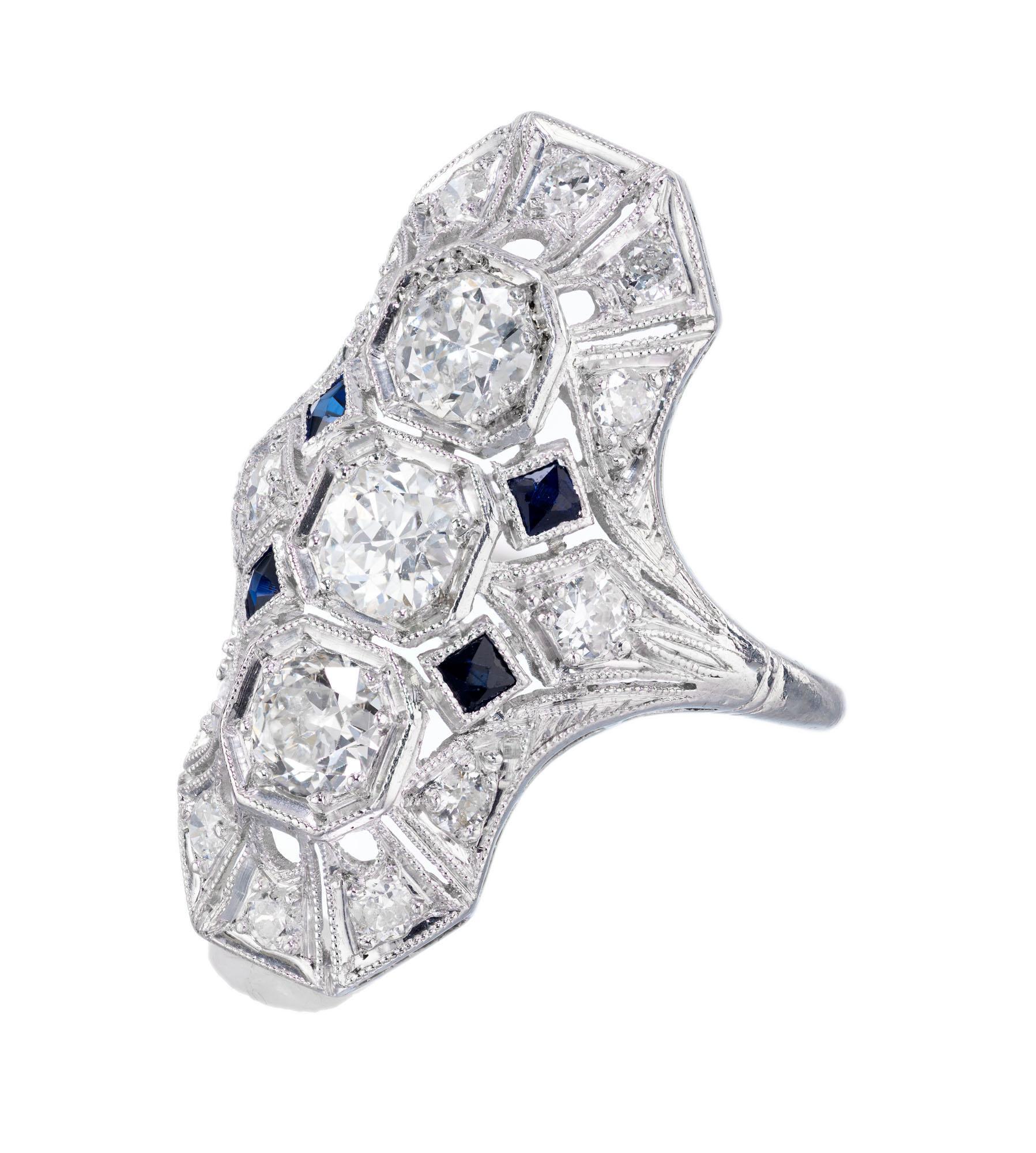 Original Art Deco 1930's diamond and sapphire ring. Pierced geometric top set with Old European cut diamonds and calibre cut sapphires in a platinum dome setting. 

1 Old European cut diamonds, H-I SI approx. .31cts
2 Old European cut diamonds, H-I