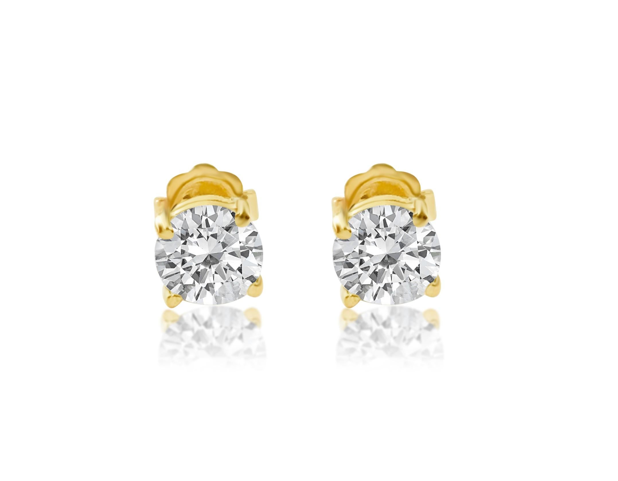 Key Features:

14kt yellow gold. 0.60 carat each diamond studs. 
Total carat weight of the diamonds: 1.20 carats. 
Clarity: I1. Color: H. Prong setting. 
Beautiful butterfly push back studs.100% natural earth mined diamonds. 
Has 14K hallmark. 
Top