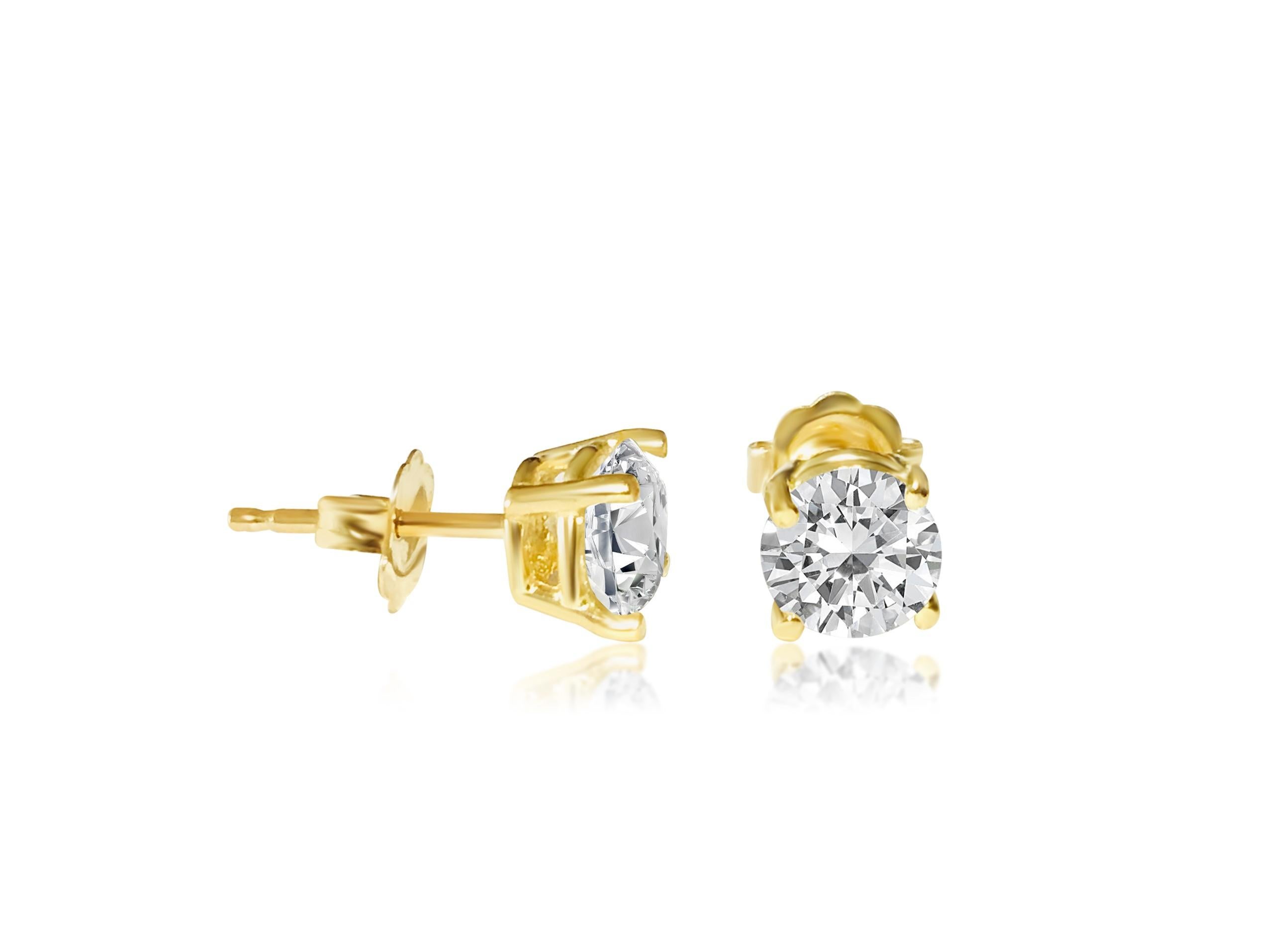 Women's or Men's 1.20 carat diamond studs in 14kt yellow gold. Custom piece For Sale