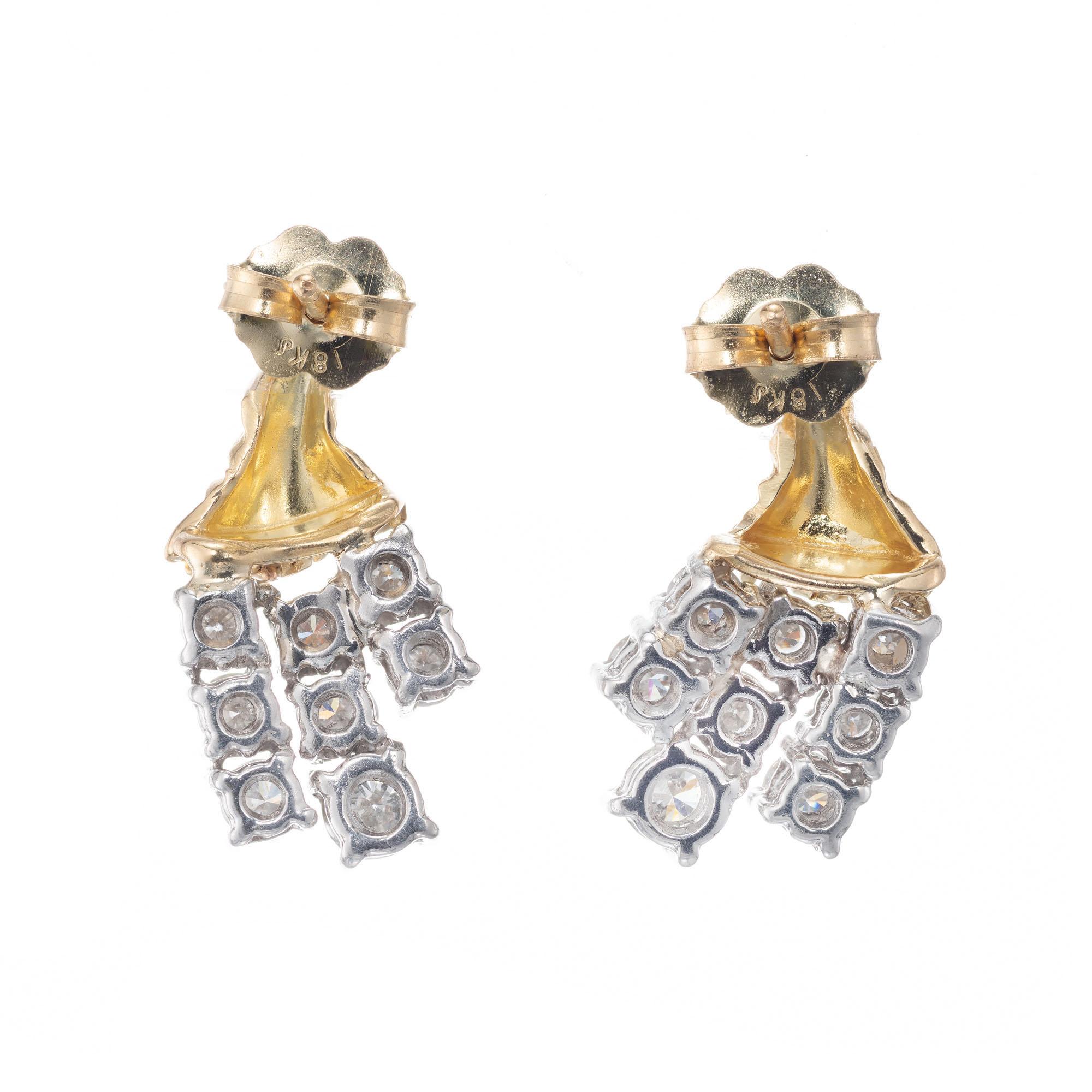 Three row diamond tassel 18k yellow gold and platinum earrings. 

16 round brilliant cut diamonds H VS2-SI, approx. 1.20cts
18k yellow gold 
Platinum 
6.3 grams
Top to bottom: 17.74mm or 11/16 Inch
Width: 10.4mm or 3/8 Inch
Depth or thickness: 6.2mm

